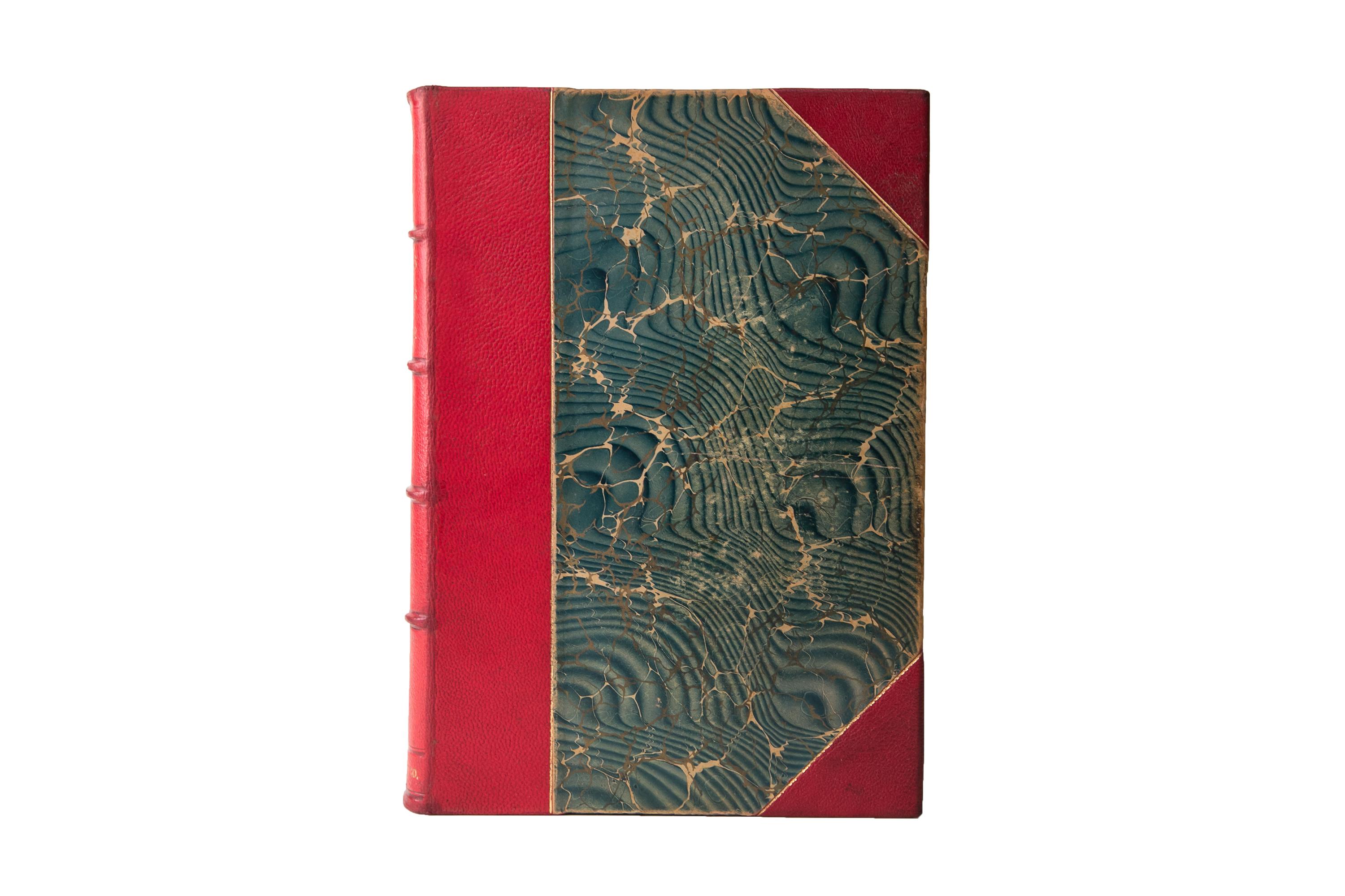 4 Volumes. Johnson & Buel, Battles and Leaders of the Civil War. Bound in 3/4 red morocco and marbled boards, bordered in gilt tooling. Raised bands with panels displaying wreath details and label lettering in gilt tooling. The top edges are gilt