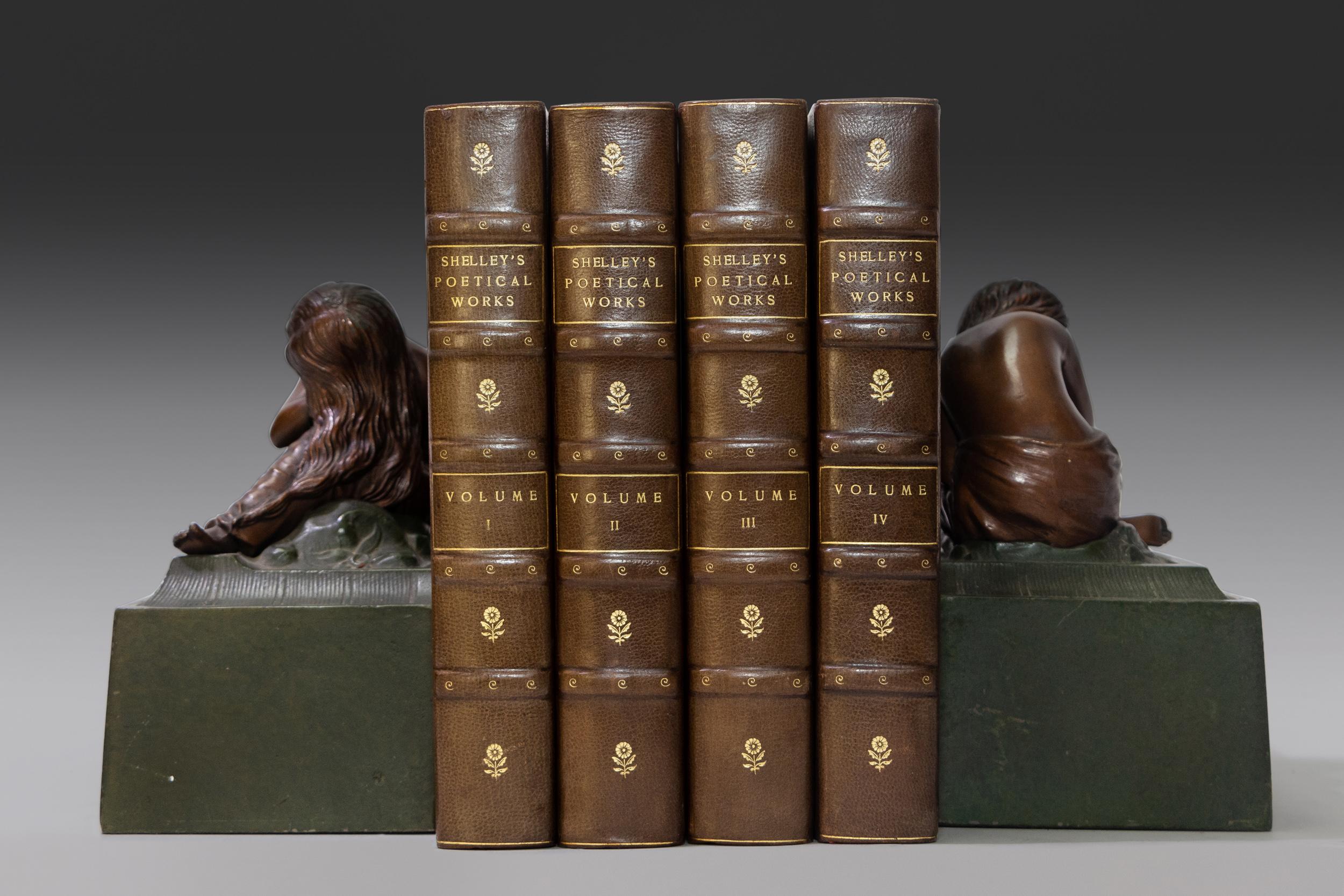 4 Volumes. Percy Bysshe Shelley, The Complete Poetical Works of Percy Bysshe Shelley. Bound in 3/4 grey morocco. Marbled boards. Raised bands. Gilt-tooled floral emblems on spine. Top edges gilt. Marbled endpapers. Illustrated. Published: Houghton,