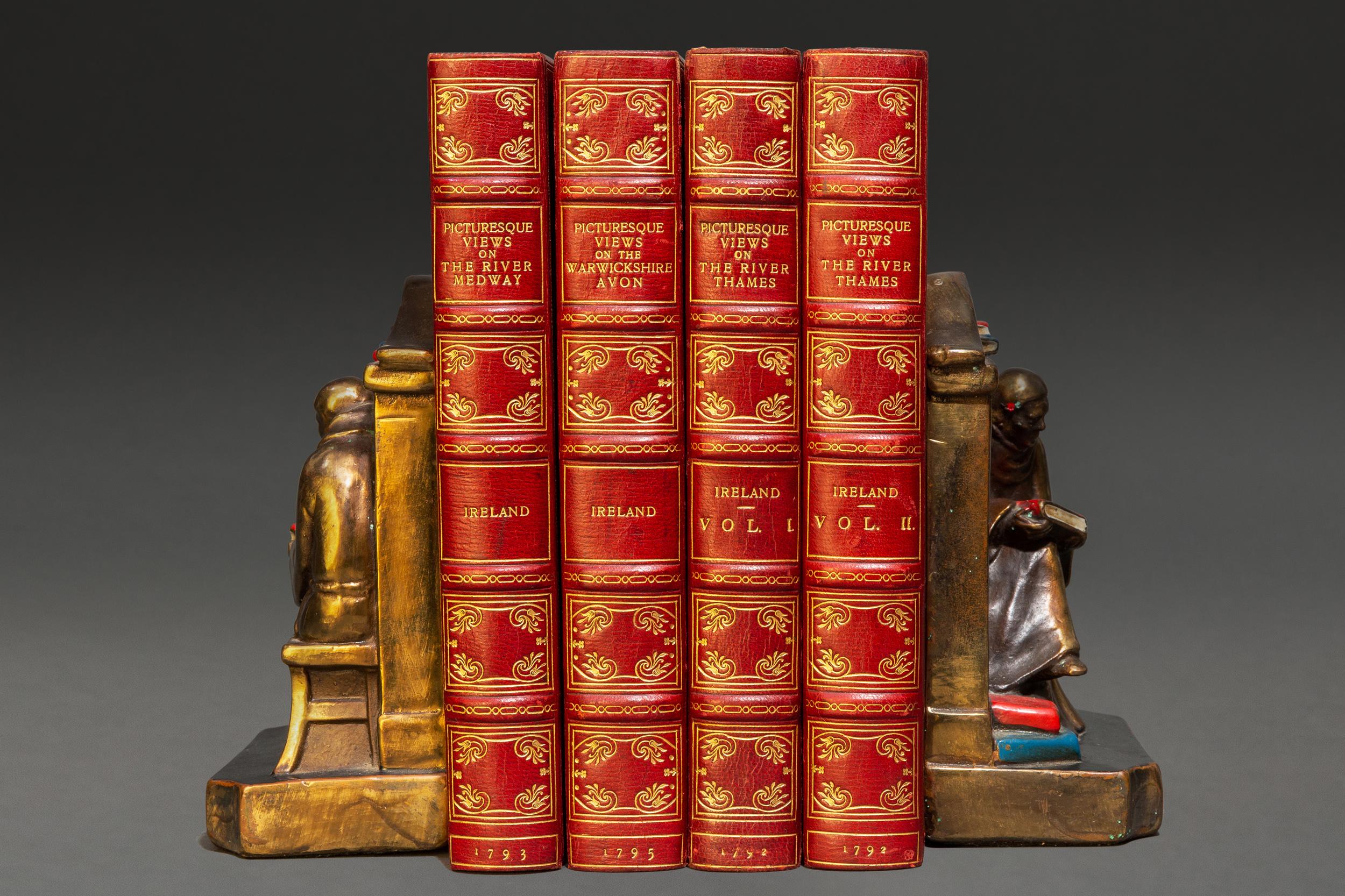 4 Volumes. Samuel Ireland. Picturesque Views on the River Thames. Bound in full red morocco, all edges gilt, raised bands, ornate gilt on covers and spines. Profusely illustrated with hand colored plates. Published: London: T. & J. Egerton 1792.