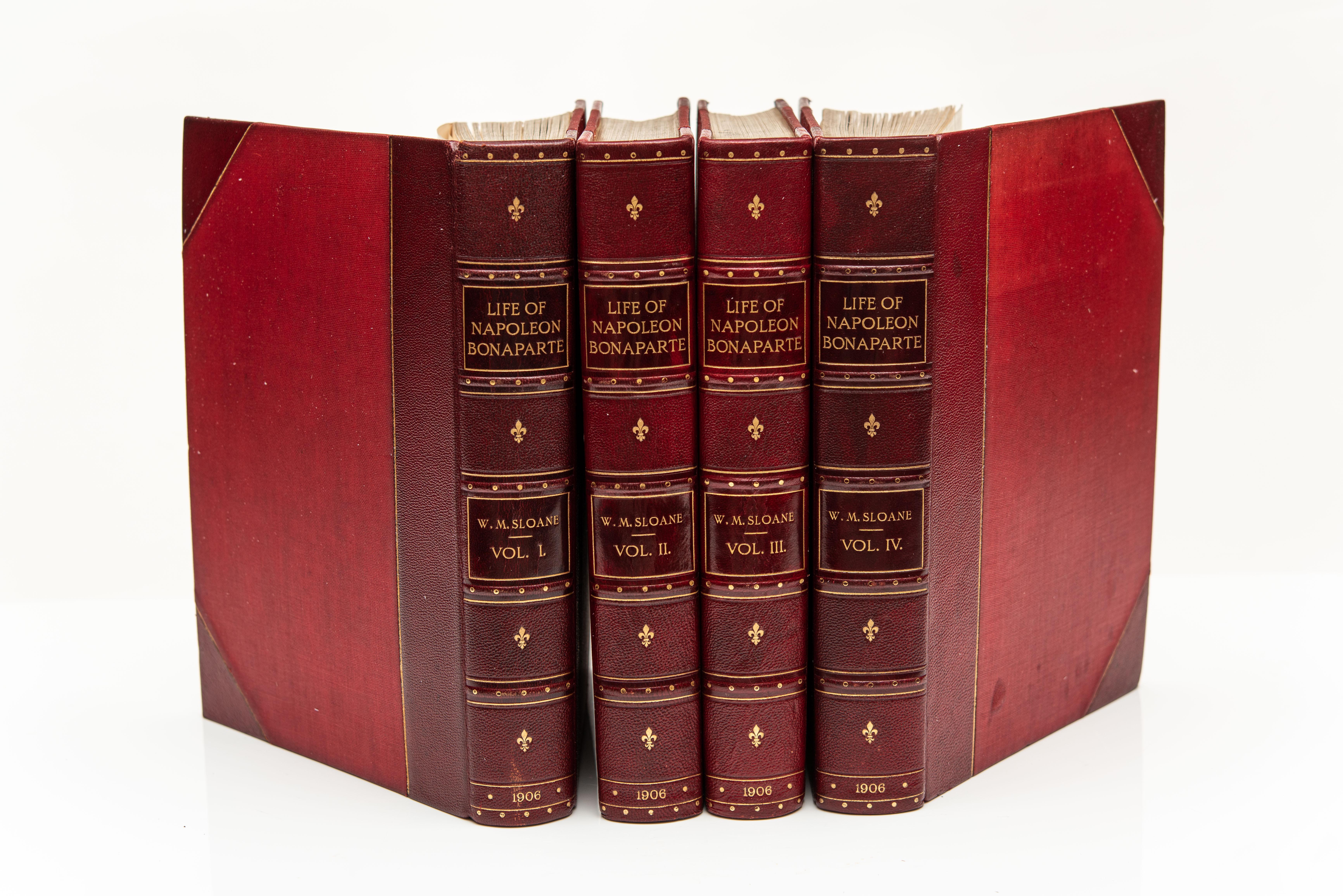 4 Volumes. Sloane, William M. Life Of Napoleon Bonaparte. Bound in 3/4 red morocco, cloth boards, top edges gilt, raised bands, gilt panels, marbled endpapers, colored frontispieces and other illustrations throughout the text. Quartos. Published: