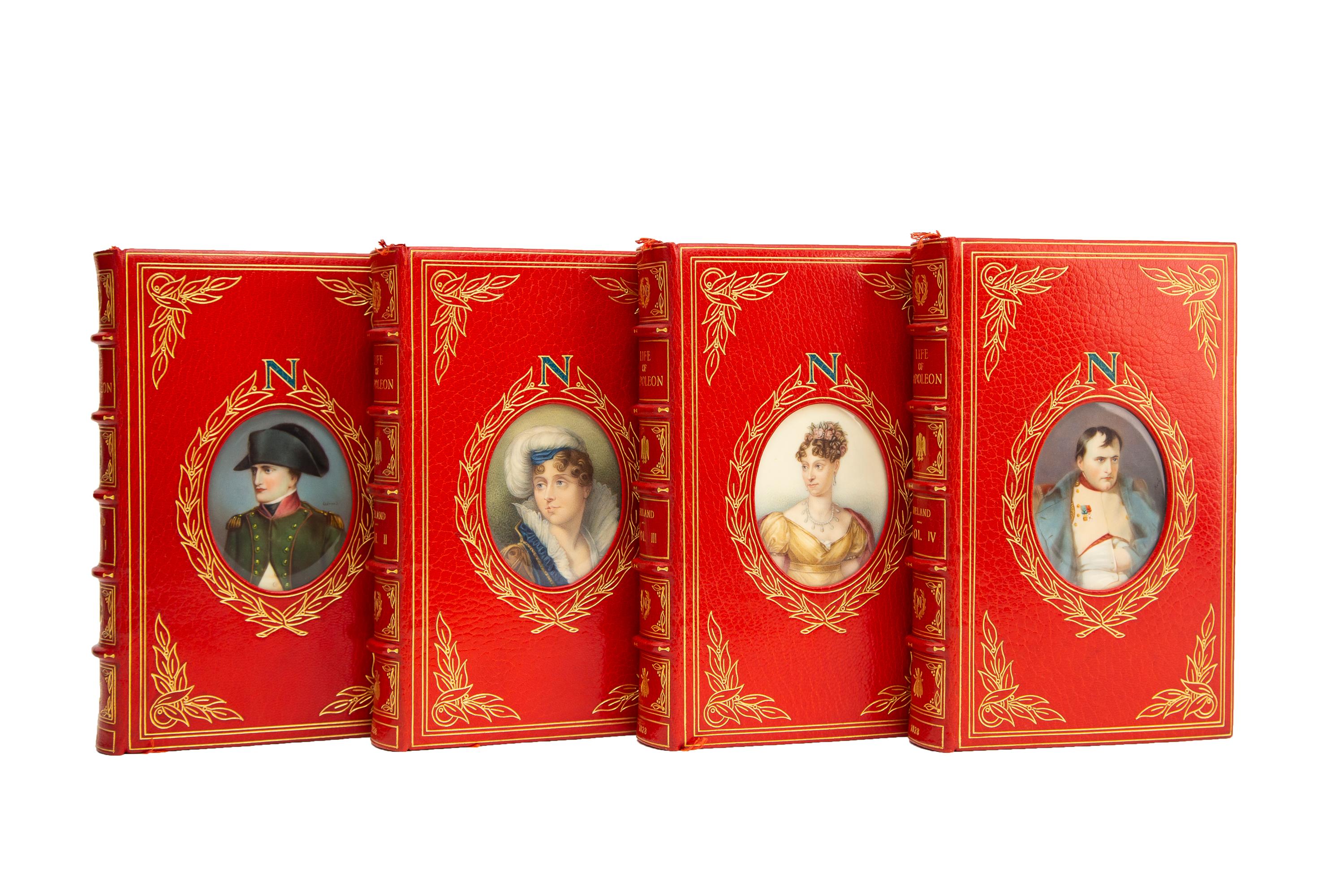 4 Volumes. W.H. Ireland, The Life of Napoleon Bonaparte. Bound in full red morocco with covers displaying hand-painted oval portrait miniatures of either Napoleon or Josephine (the Napoleon portraits are after the artists Gerard and René) in an