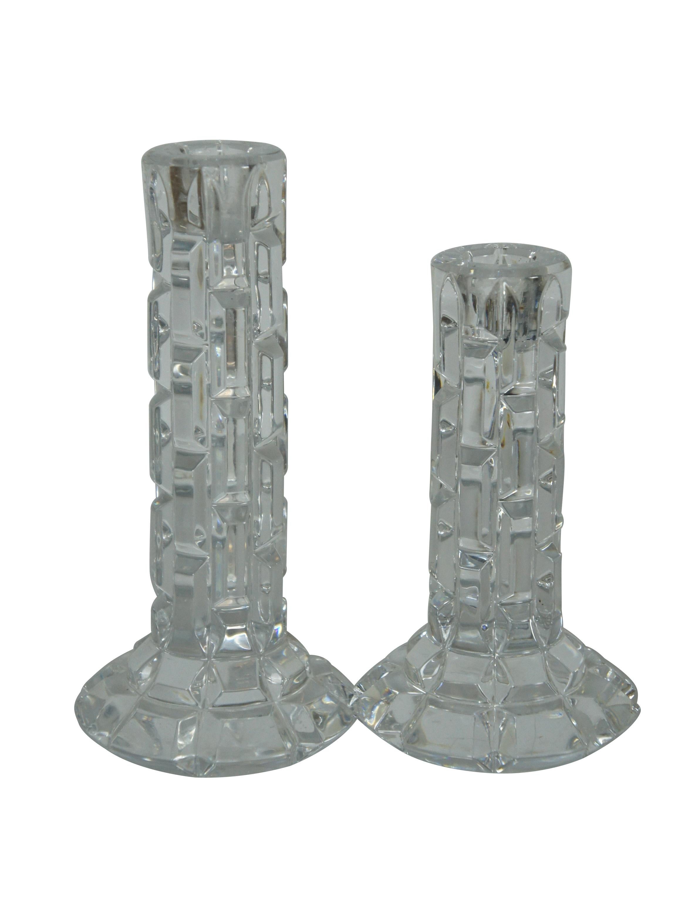 Set of four late 20th century Waterford cut crystal Luma / Illuminology candlesticks. Column design with splayed bases, cut in a modern geometric stone / brick pattern.

Dimensions:

Tall - 4
