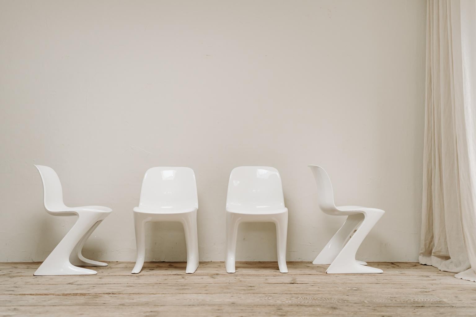 This set of white Kangaroo chairs were designed by Ernst Moeckl in 1968.
The chair is also called the Z-chair, referring to its shape. During the period of the Iron Curtain, the Panton chair was produced in Western Europe while Easter Germany