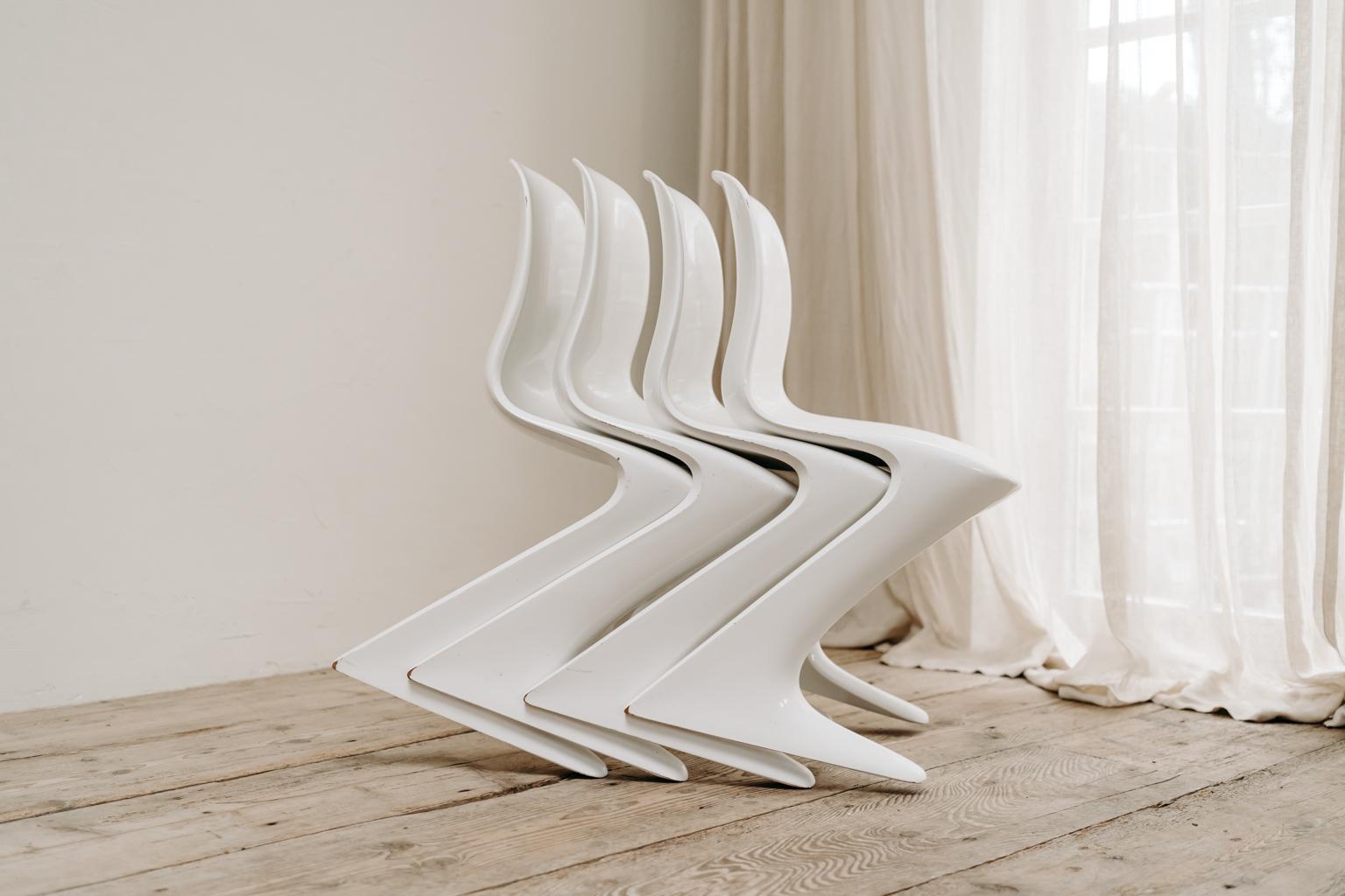 4 White Kangaroo Chairs by Ernst Moeckl 2