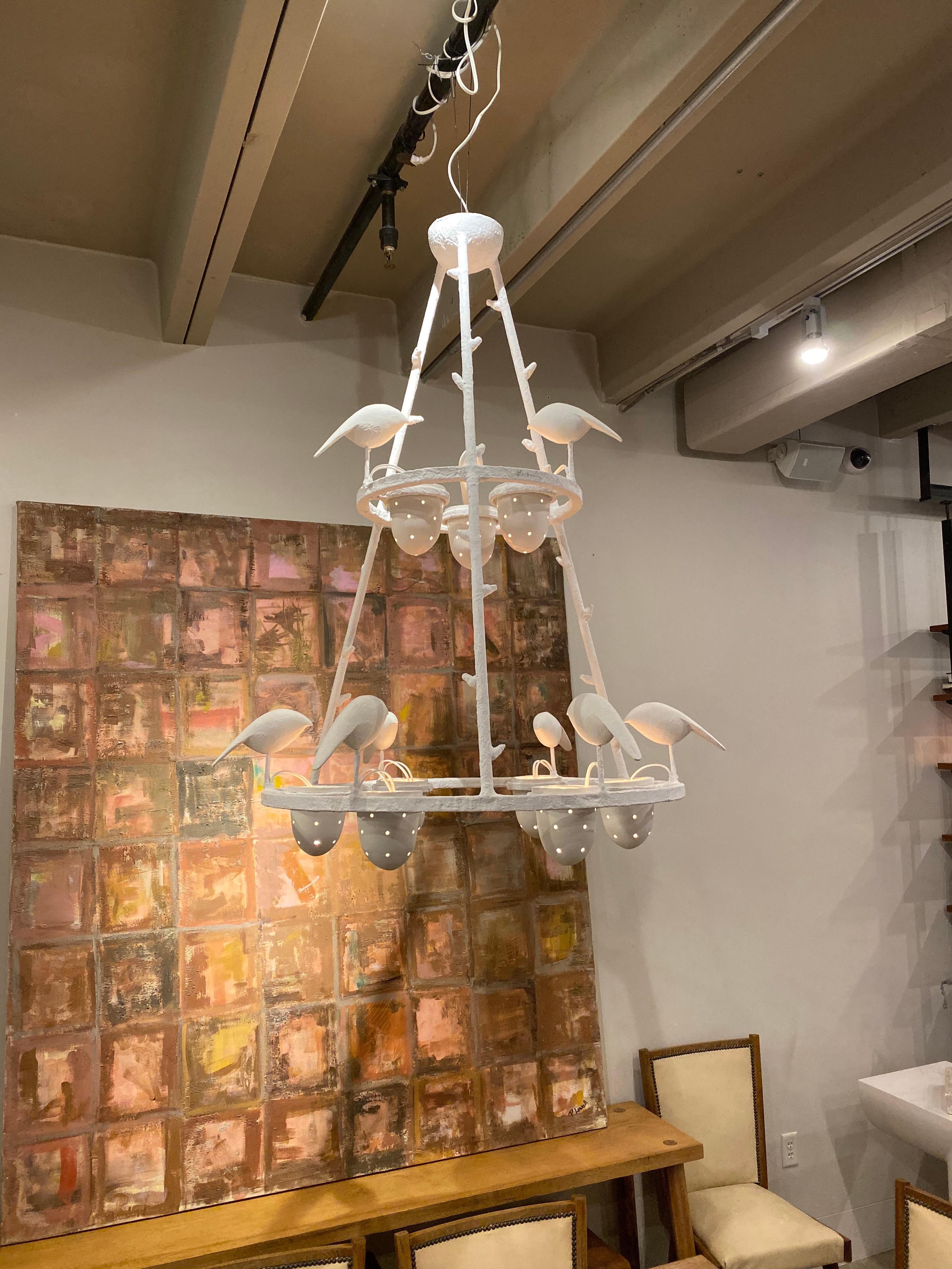 Jacques Darbaud's metal, plaster and porcelain chandelier, France, early 21st century. Plaster birds perch around a metal and plaster frame. Perforated porcelain cups hold the bulbs. Excellent condition. Jacques Darbaud aka Darbaud is a sculptor,