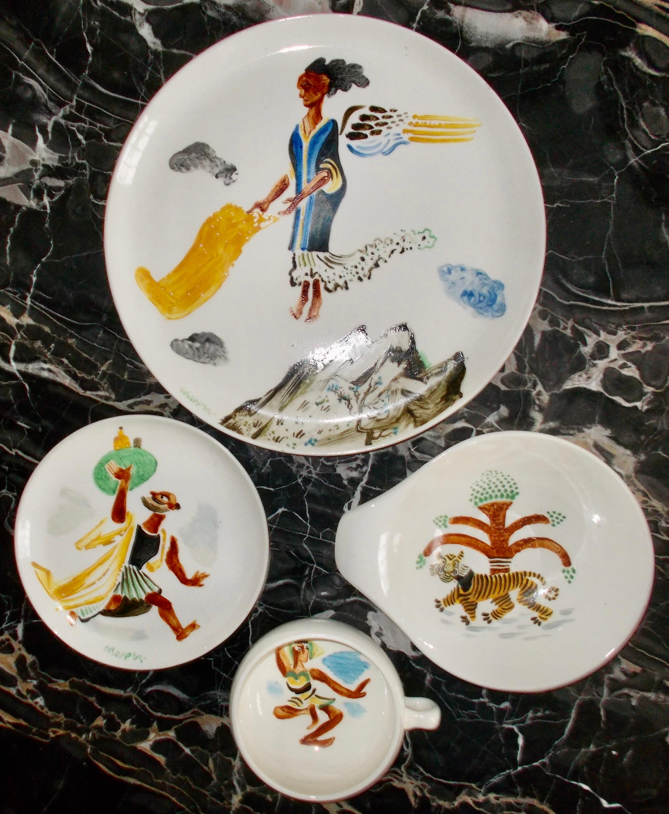 A set of four: cup, saucer, dinner plate and bowl, with paintings of mythological subjects on each by William Gropper. Russel Wright's 