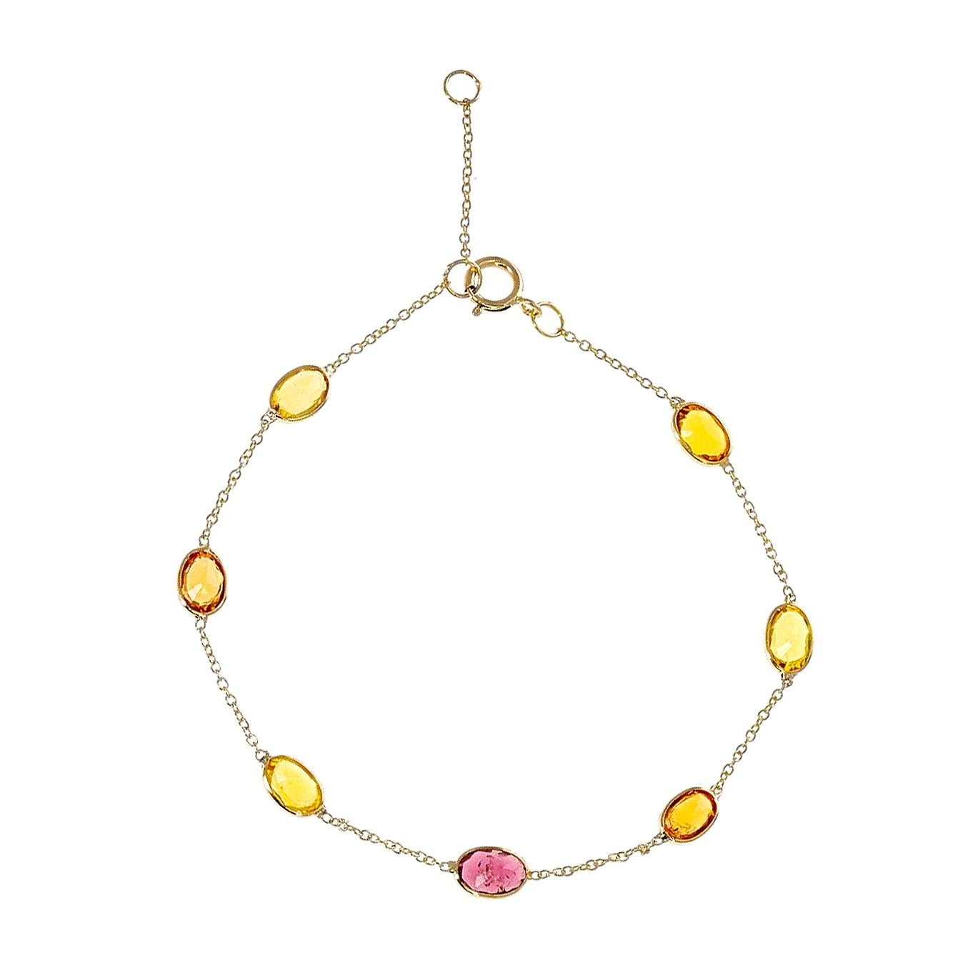 A 4 x 6 Oval Genuine Multi-Sapphire 18k Yellow Gold Adjustable Bracelet. The length of the bracelet can either be 6.75