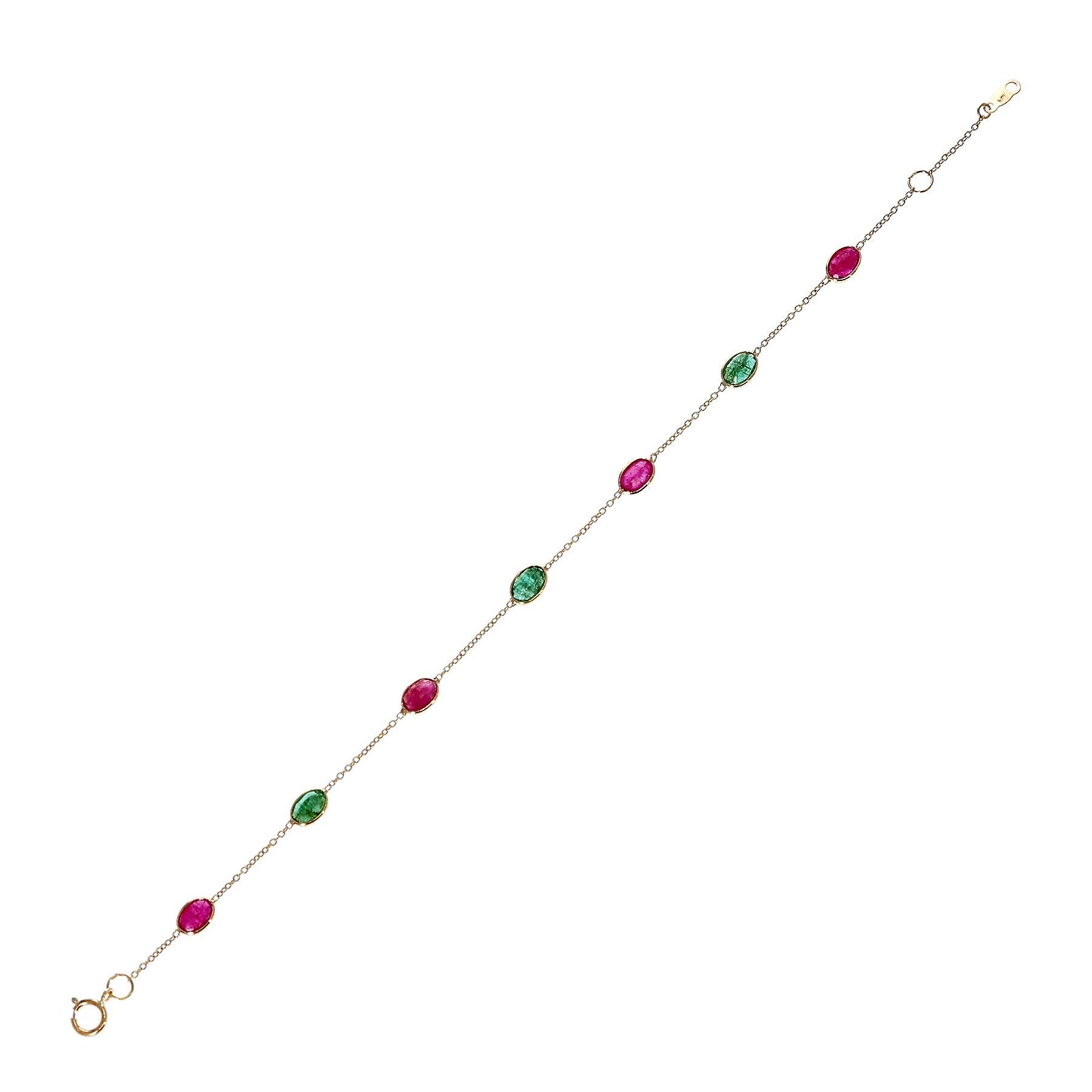 An Oval Genuine Ruby and Emerald 18k Yellow Gold Adjustable Bracelet. The length of the bracelet can either be 6.75