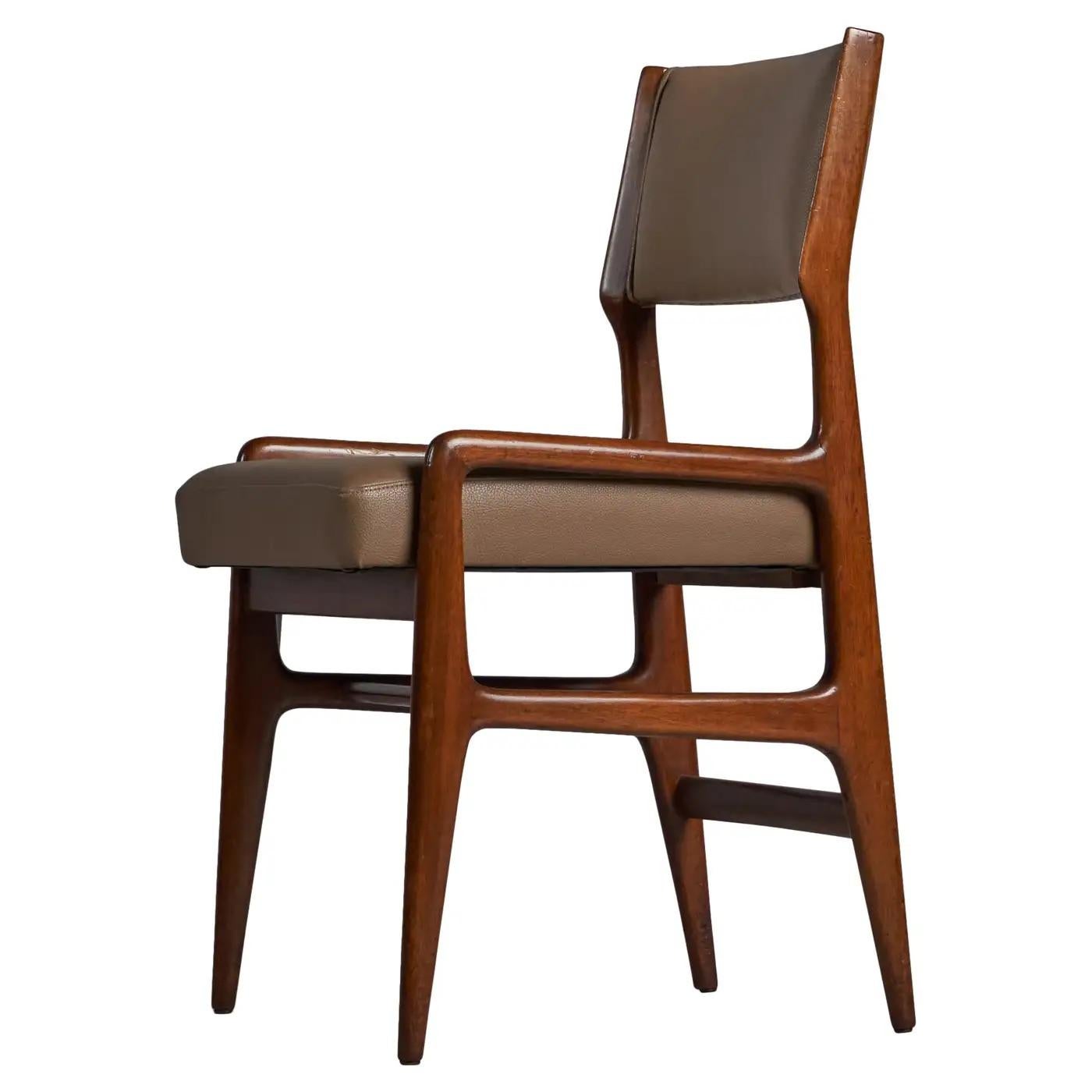 A walnut and brown leather dining chair, designed by Gio Ponti and produced by Figli di Amedeo Cassina, Italy 1960s.

19.25” seat height