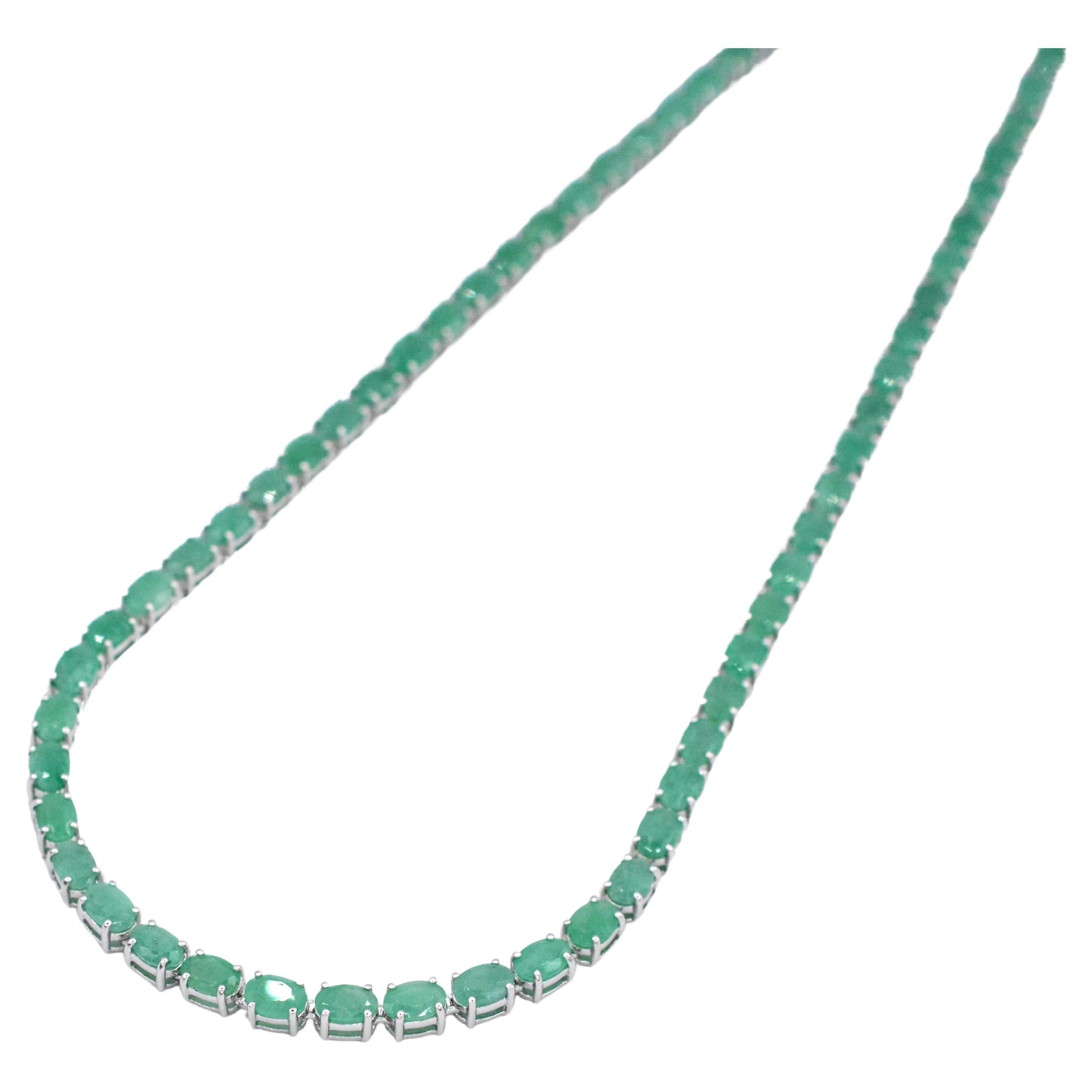 Indulge in the elegance of our 40-1/6ct. Oval Genuine Emerald 18