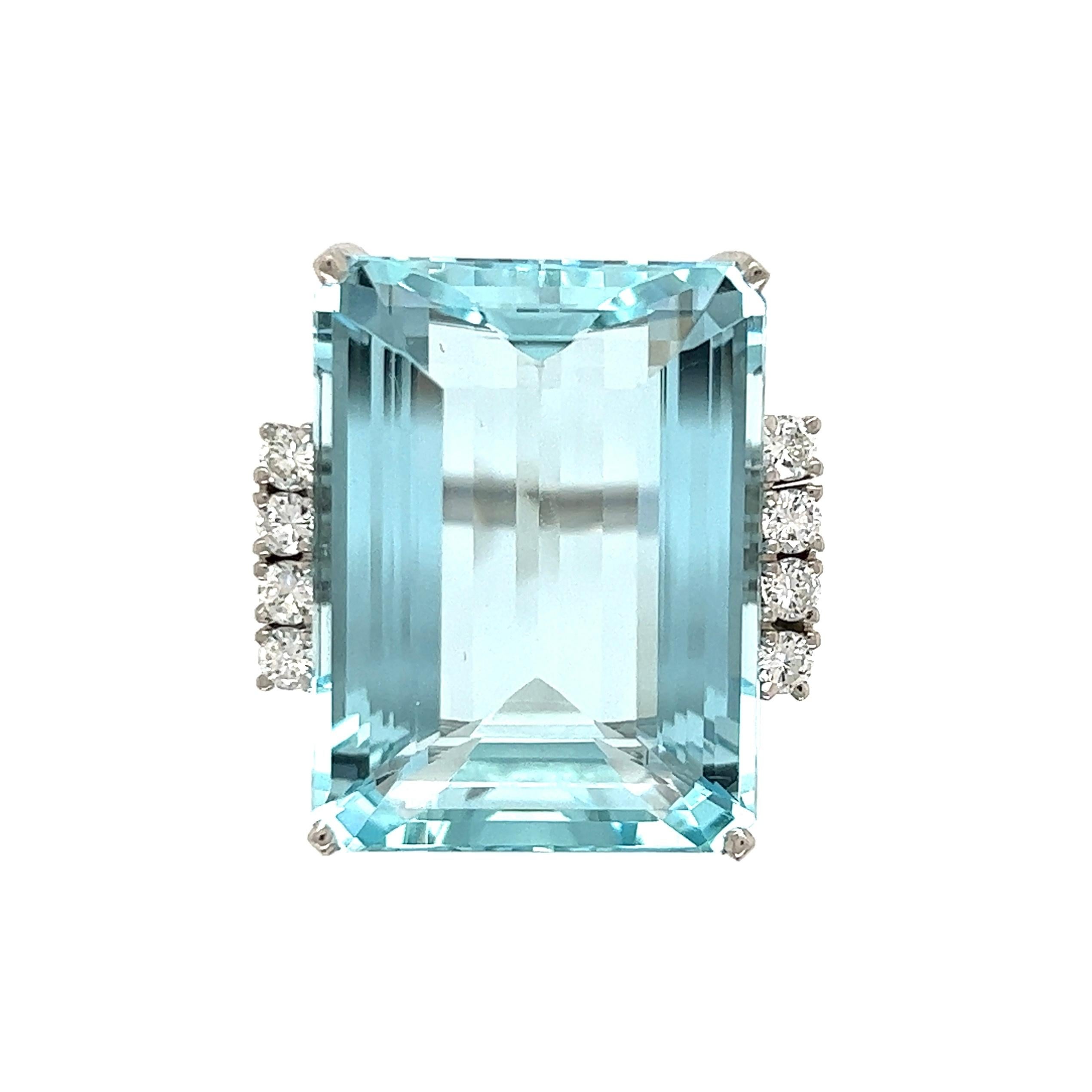 Simply Beautiful! Aquamarine and Diamond Platinum Retro Ring. Center securely set with an Aquamarine weighing 37.50 Carat. Both sides of ring Hand set with Diamonds, approx. 0.35tcw. Hand crafted Platinum mounting. Dimensions: 1.14” l x 0.85” w x