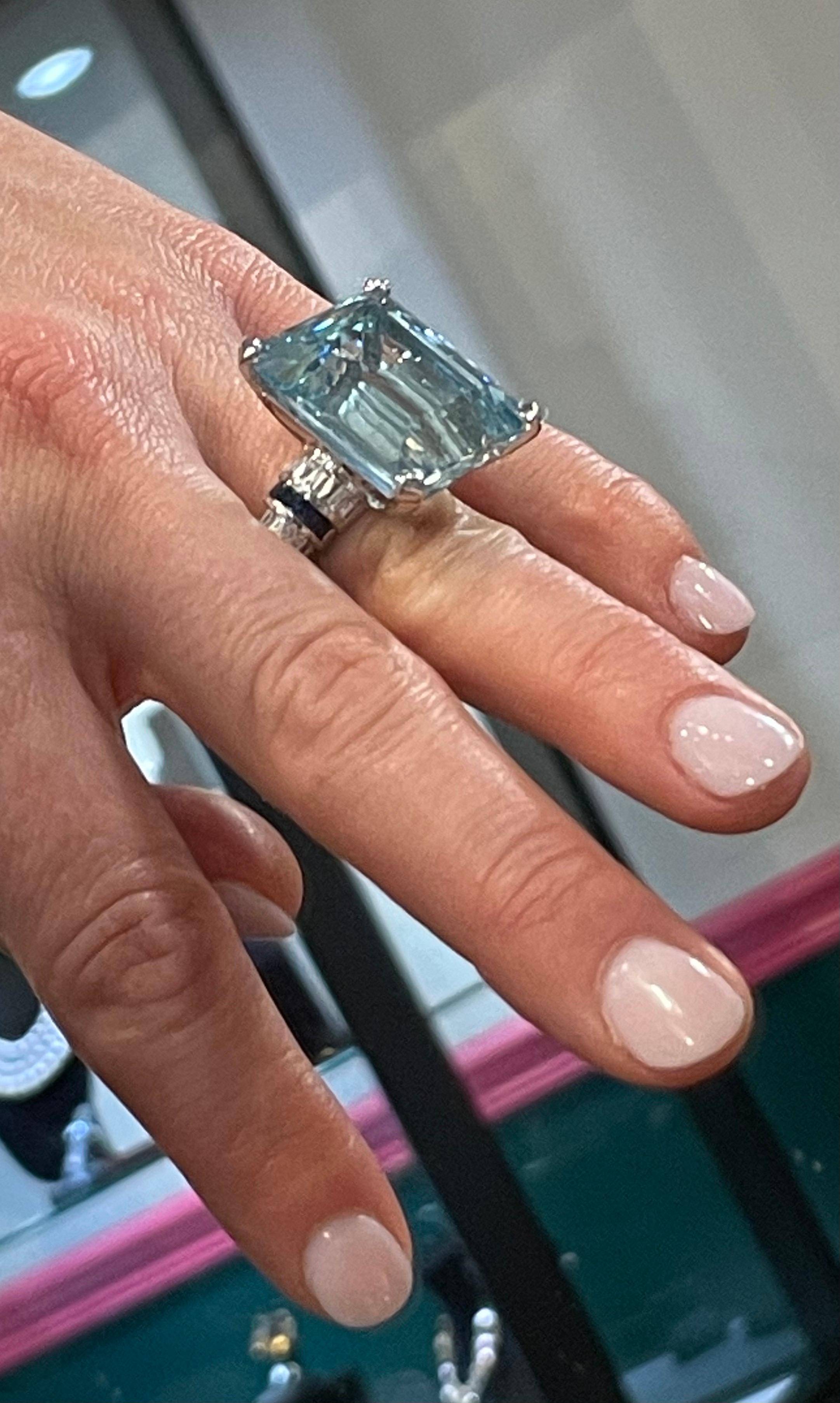40.55ct emerald cut aquamarine accented with diamonds and sapphires set in 18kt white gold.
Incredible color and size.
Ring size 6
