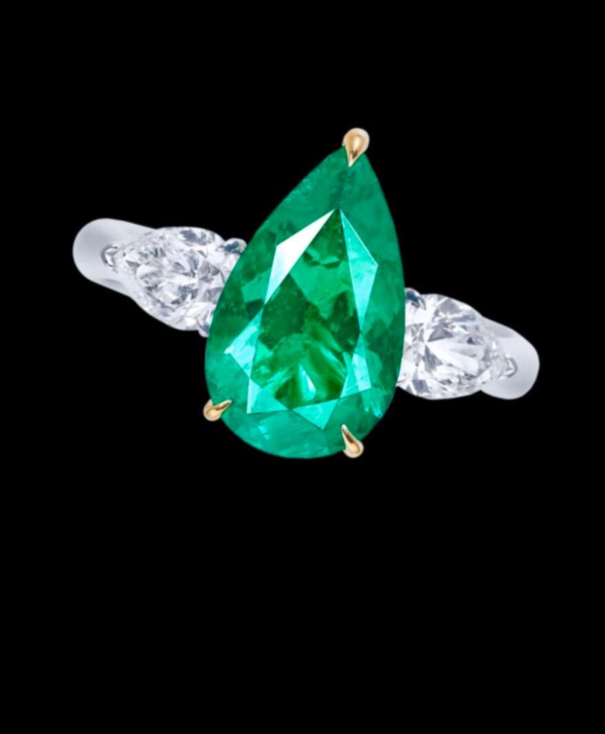 Showcasing certified Colombian emeralds totaling approximately 40 carats for the set of necklace, ring, and earrings. These emeralds are untreated/no oil and Vivid Green Muzo Color.  This emerald suite is perfect for the avid collector. The emeralds