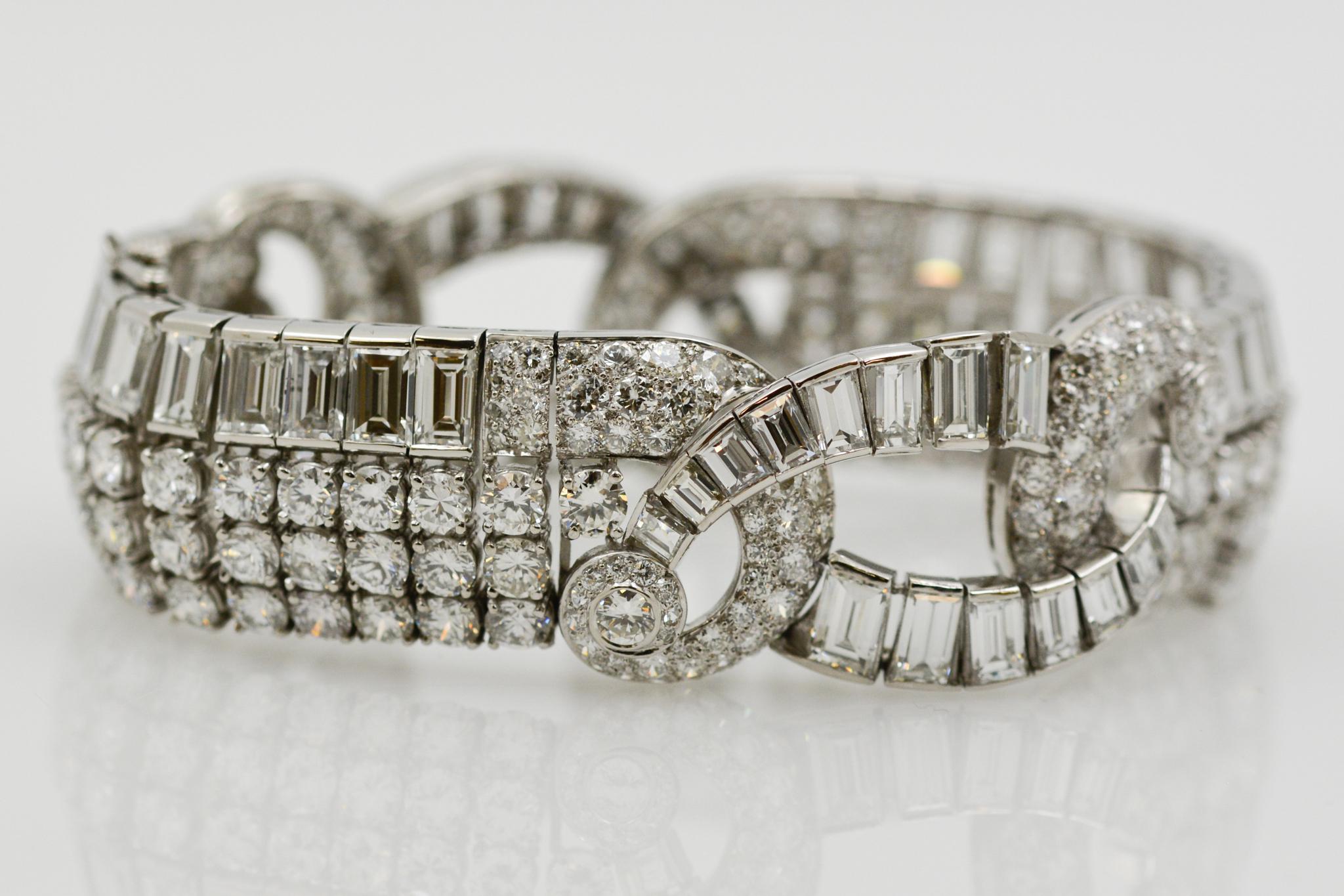 This platinum Art Deco bracelet displays lavish elegance with an intricate design of 51 baguette and 263 round diamonds with a combined total weight of 37.00 carats GH VS. The bracelet measures at ¾” wide and 7” long with decadence you can feel.