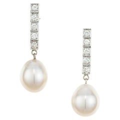 Boucles d'oreilles pendantes en or blanc avec perles d'eau douce et diamants de .40 carats 