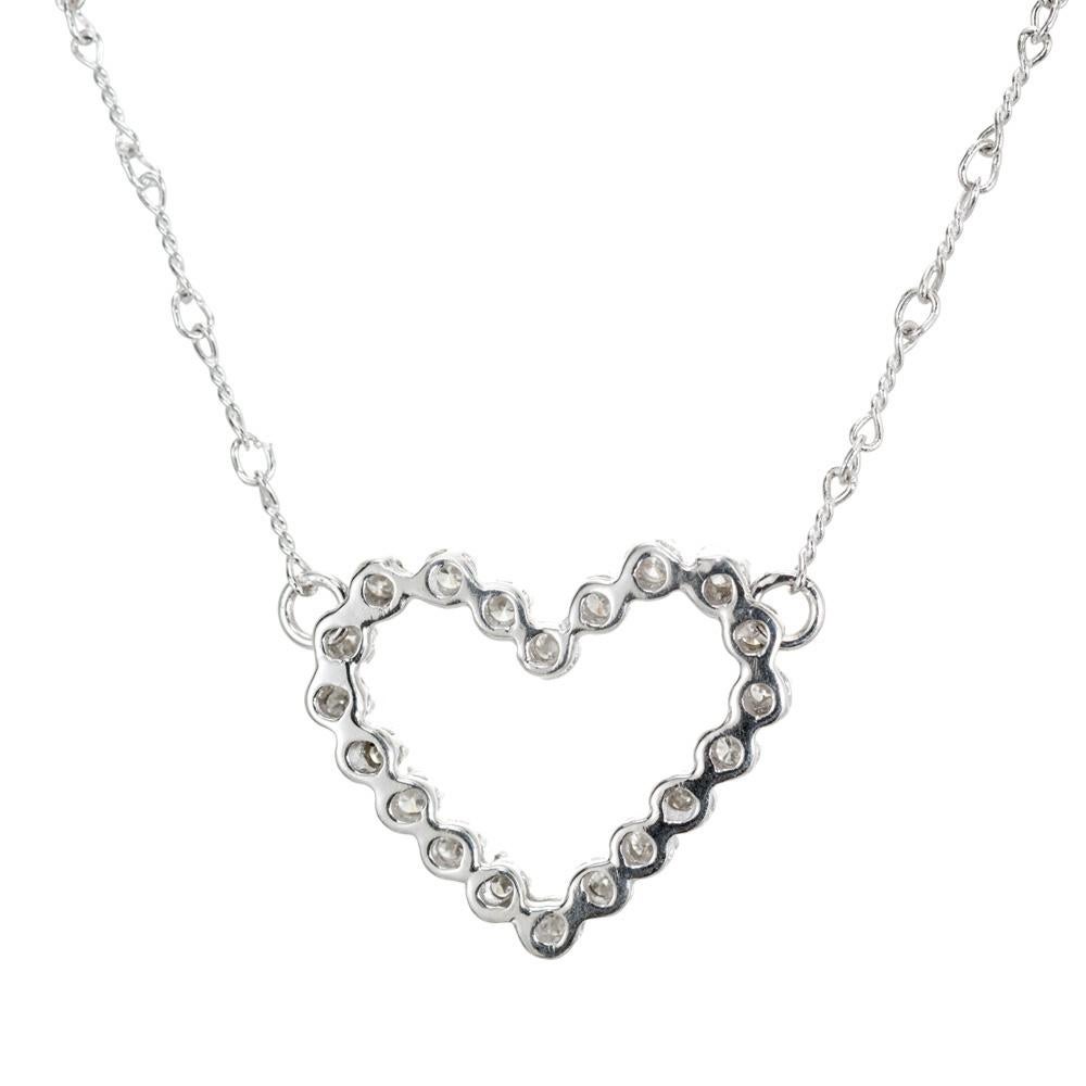Diamond heart pendant. 20 round diamonds set in a 14k white heart shaped setting with a 17 inch 14k white gold chain. 

20 round diamonds, I-J SI approx. .40cts
14k white gold 
Stamped: 14k
4.4 grams
Top to bottom: 18.3mm or .75 Inches
Width:20.5mm