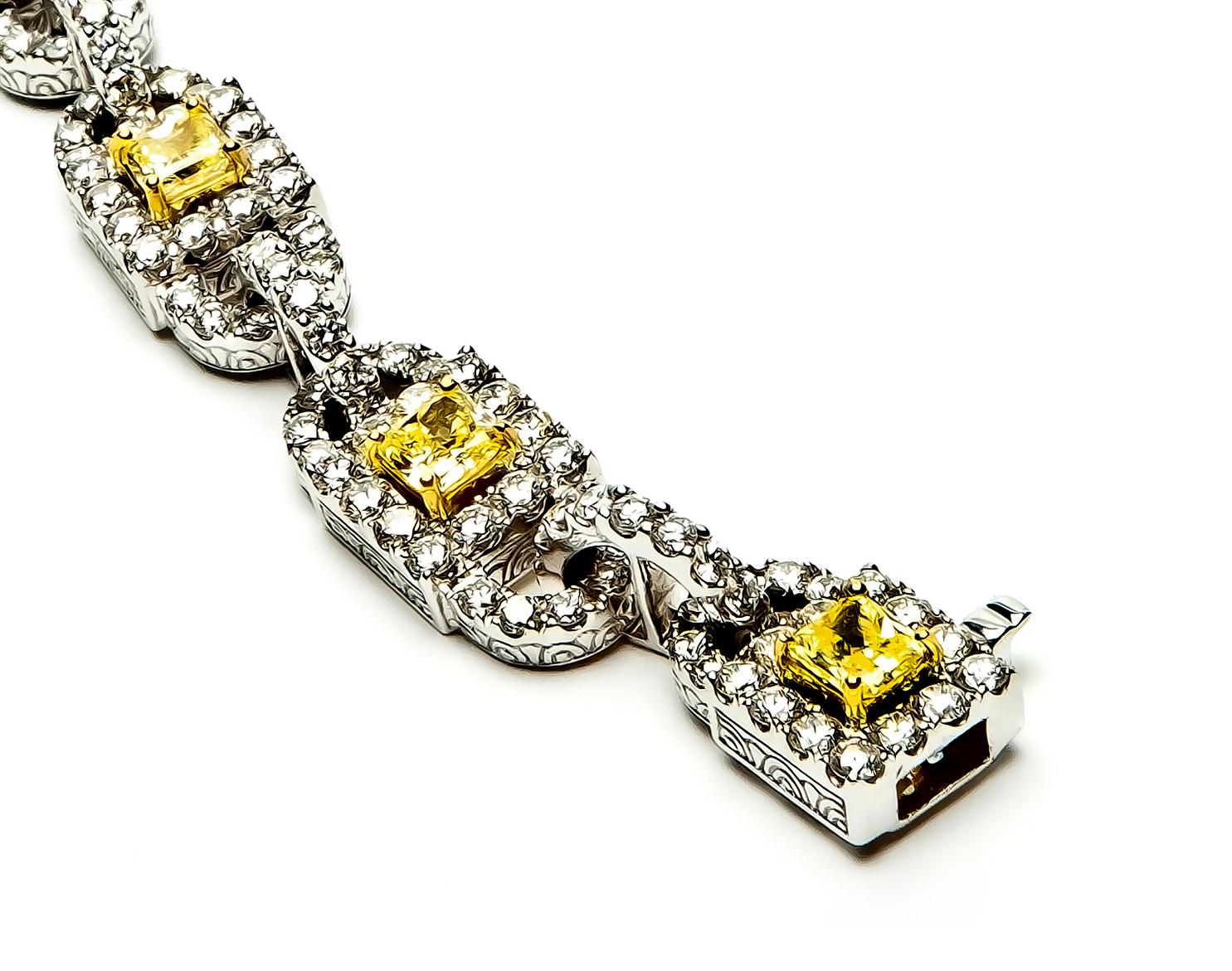 Marvel at an 18 karat White Gold link bracelet, designed by world-renowned jewelry designer, Danuta, which is set with eight individual princess cut Fancy Intense Yellow/VS1 Diamonds, each approximately .50 carats or totaling 4.0 carats and adorned