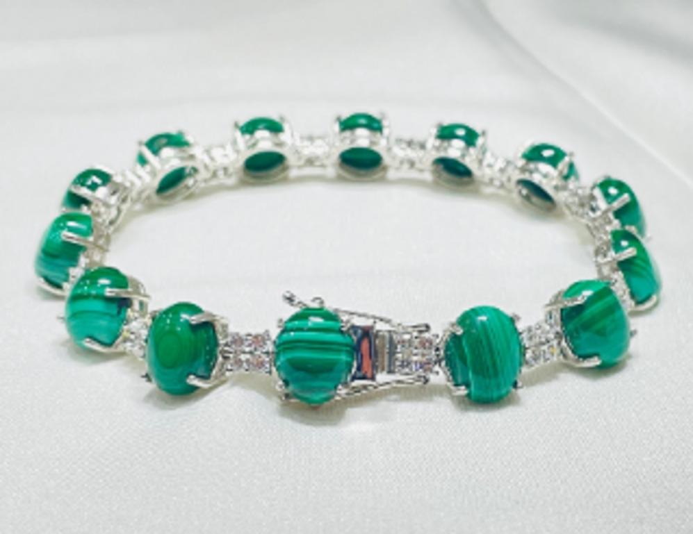 Beautifully handcrafted silver 40 Carat Malachite and 2 Carat Diamond Tennis Bracelet, designed with love, including handpicked luxury gemstones for each designer piece. Grab the spotlight with this exquisitely crafted piece. Inlaid with natural