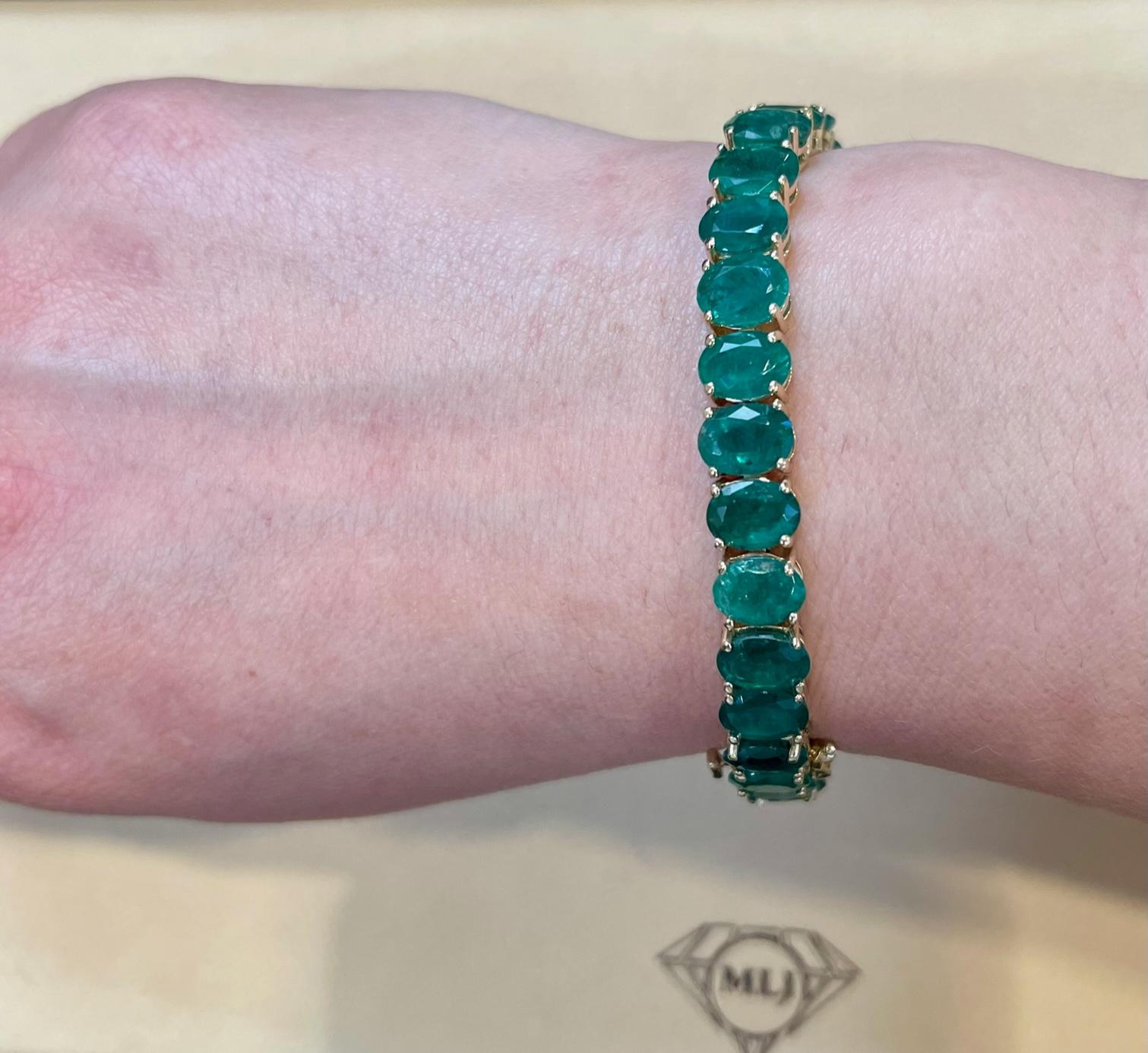  This exceptionally Beautiful Tennis  bracelet has 30 stones of oval  Emeralds  .  Total weight of the Emeralds is  approximately 40 carat. 
The bracelet is expertly crafted with 22.12  grams of  14 karat Yellow  gold .including the stones. Have a