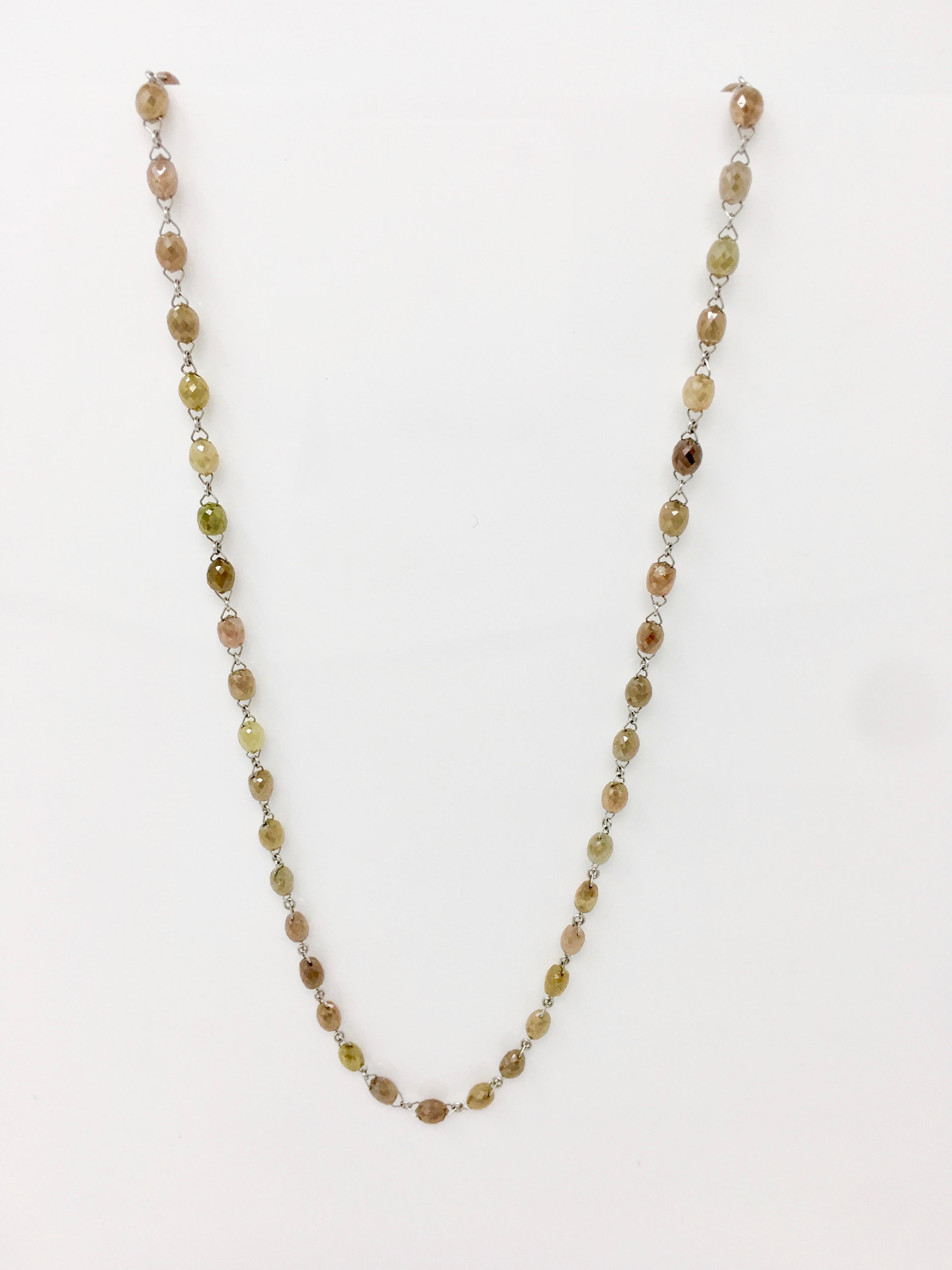 Simply elegant necklace featuring sparkling faceted multicolored  diamond beads ( with green, pink and brown hues ) weighing 40 carats. Handcrafted in USA by a master jeweler in 18k gold. Elegant and gracious, this 18 inches long necklace is a
