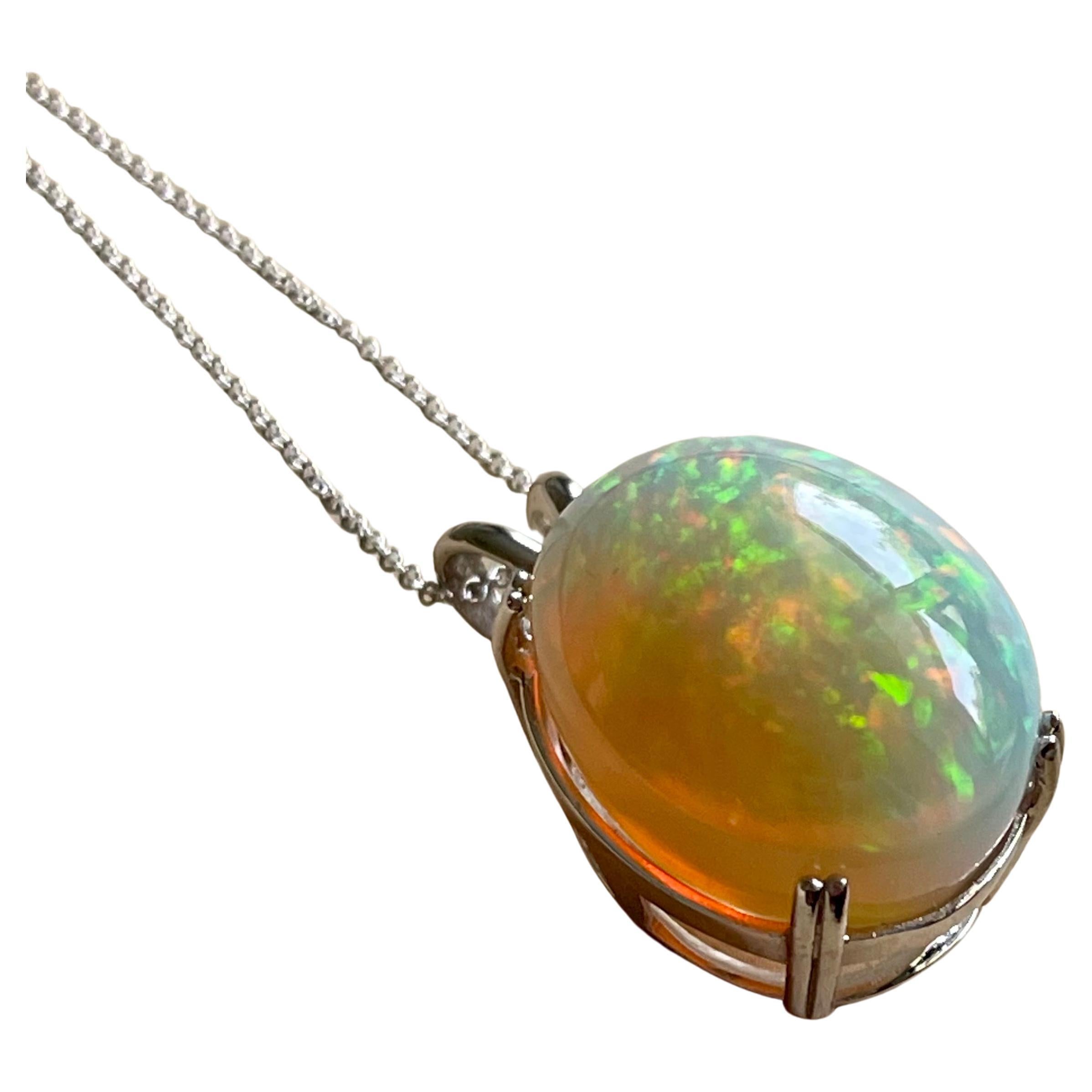 Approximately 40 Carat Oval Ethiopian  Opal Pendant /  Necklace 14 Kt white  Gold Necklace with Chain
This spectacular Pendant Necklace consisting of a single Oval Shape Ethiopian Opal Approximately 40 Carat. 
25X19MM size of opal
very clean Stone