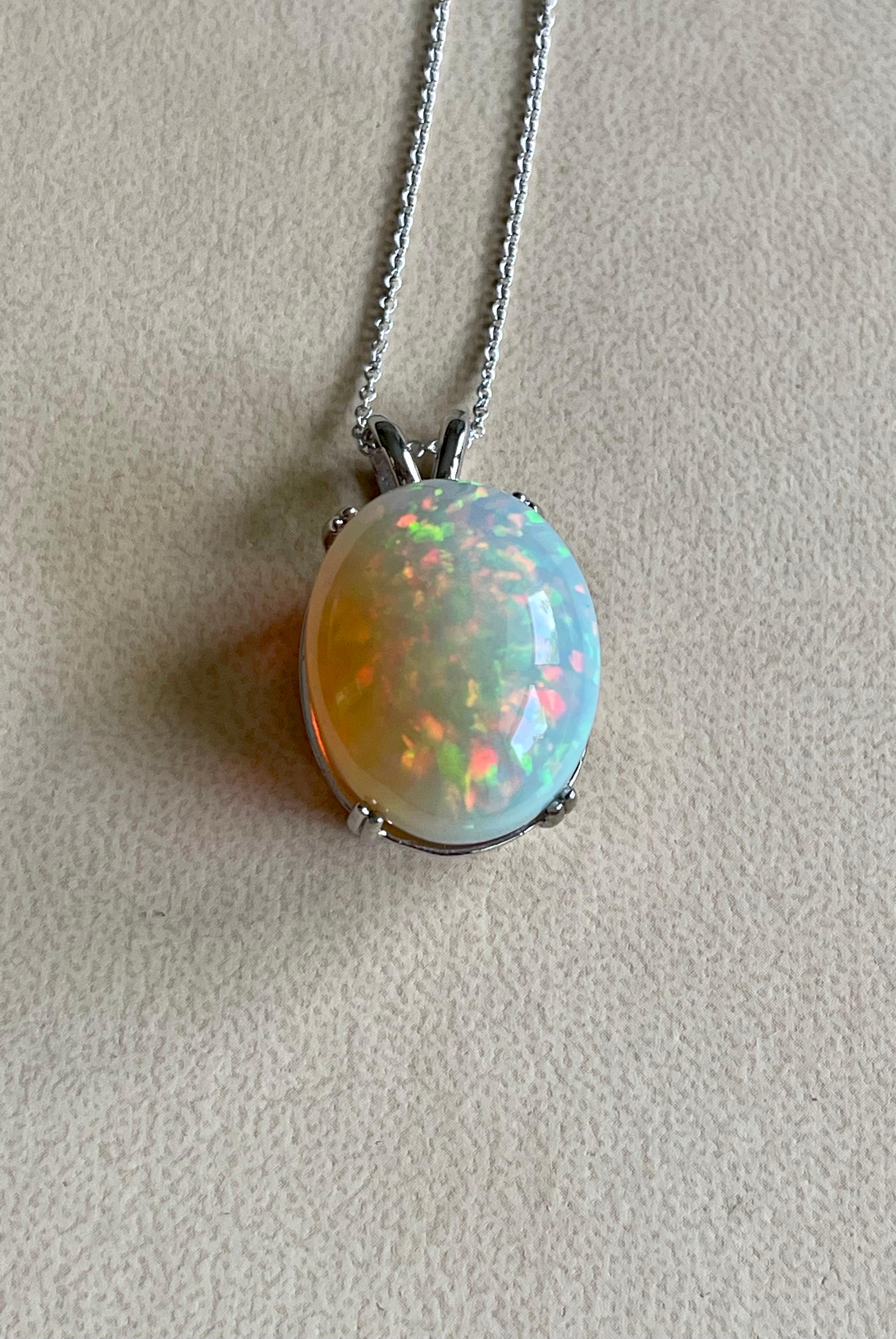 40 Carat Oval Ethiopian Opal Pendant / Necklace 14 Karat Yellow Gold Necklace In Excellent Condition For Sale In New York, NY