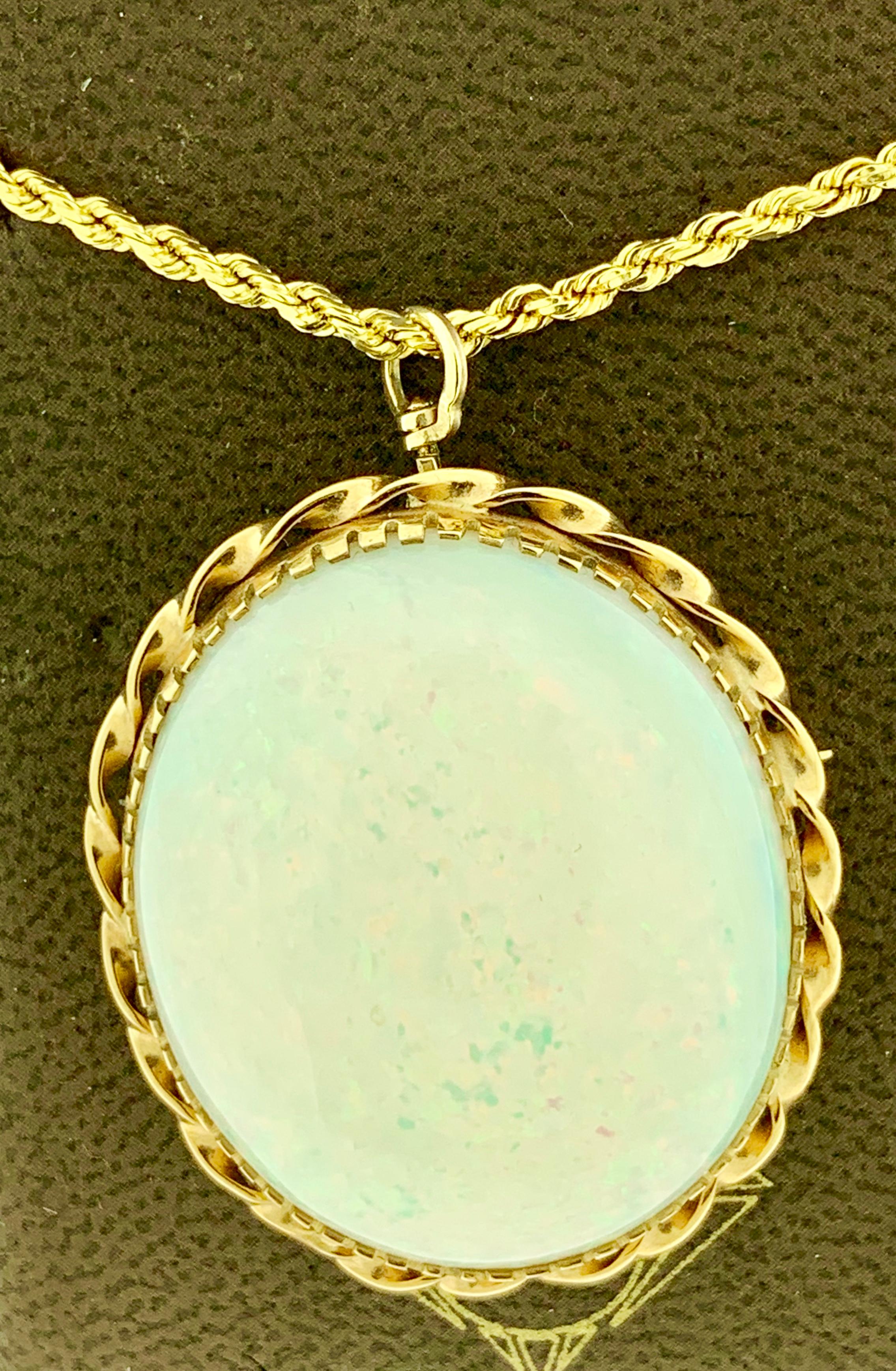  40 Carat  Oval Ethiopian  Opal  pin / Pendant Necklace 14 Karat Yellow Gold Estate 
This spectacular Pendant Necklace  consisting of a single Oval    Shape Ethiopian  Opal Approximately 40 Carat.  This can be worn as pin or as a Pendant
very clean