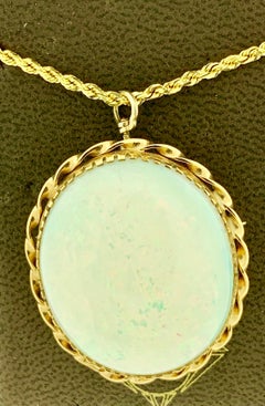 40 Carat Oval Ethiopian Opal Pin / Pendant Necklace 14 Karat Yellow Gold