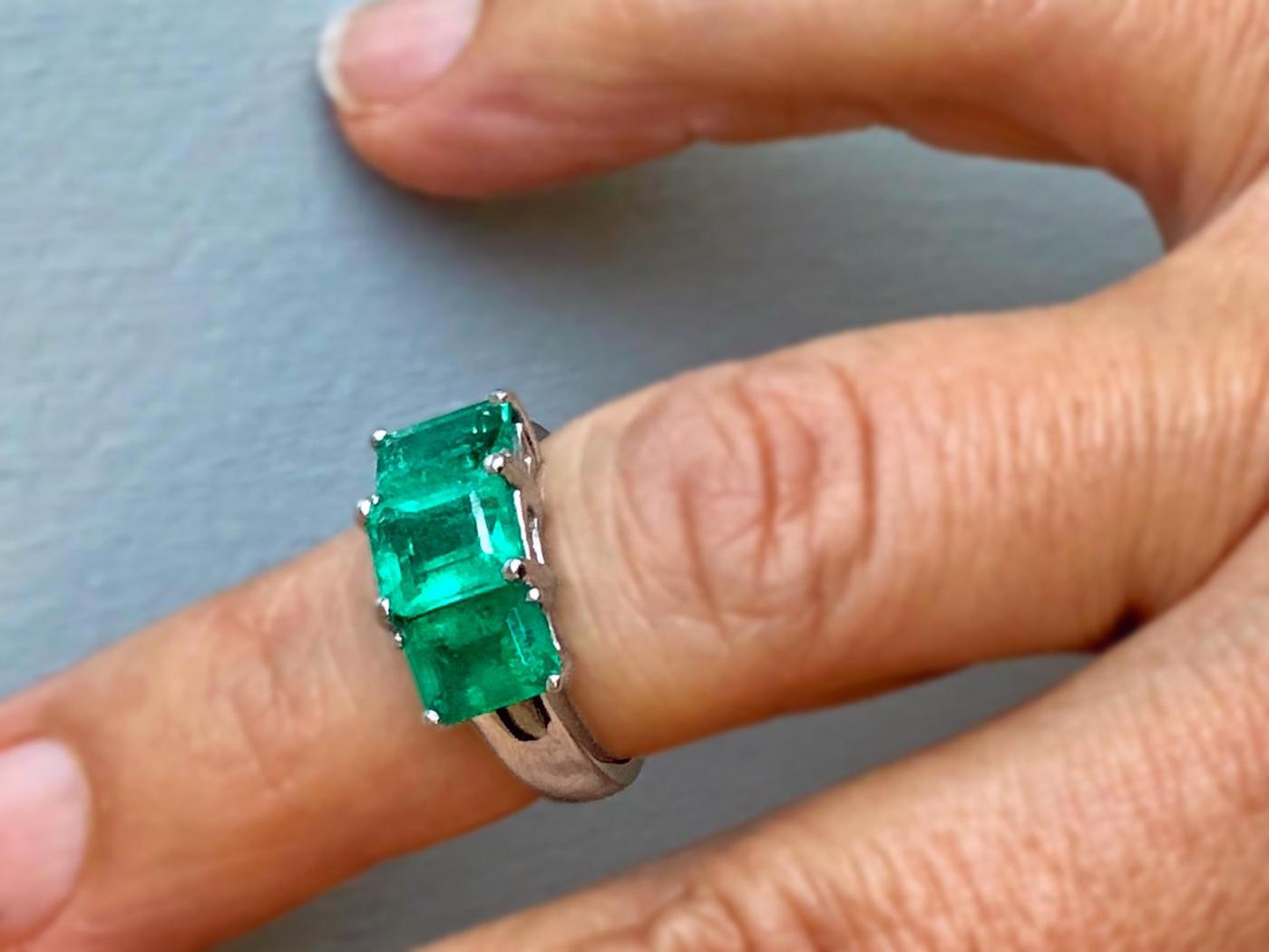 This is a beautiful and classic design Emerald Platinum Three Stone Engagement Ring
Feature three genuine and natural COLOMBIAN emeralds, emerald cut weighing approx. 4.0 Carat. The emerald are prong set shimmering medium green, clarity VS. The ring