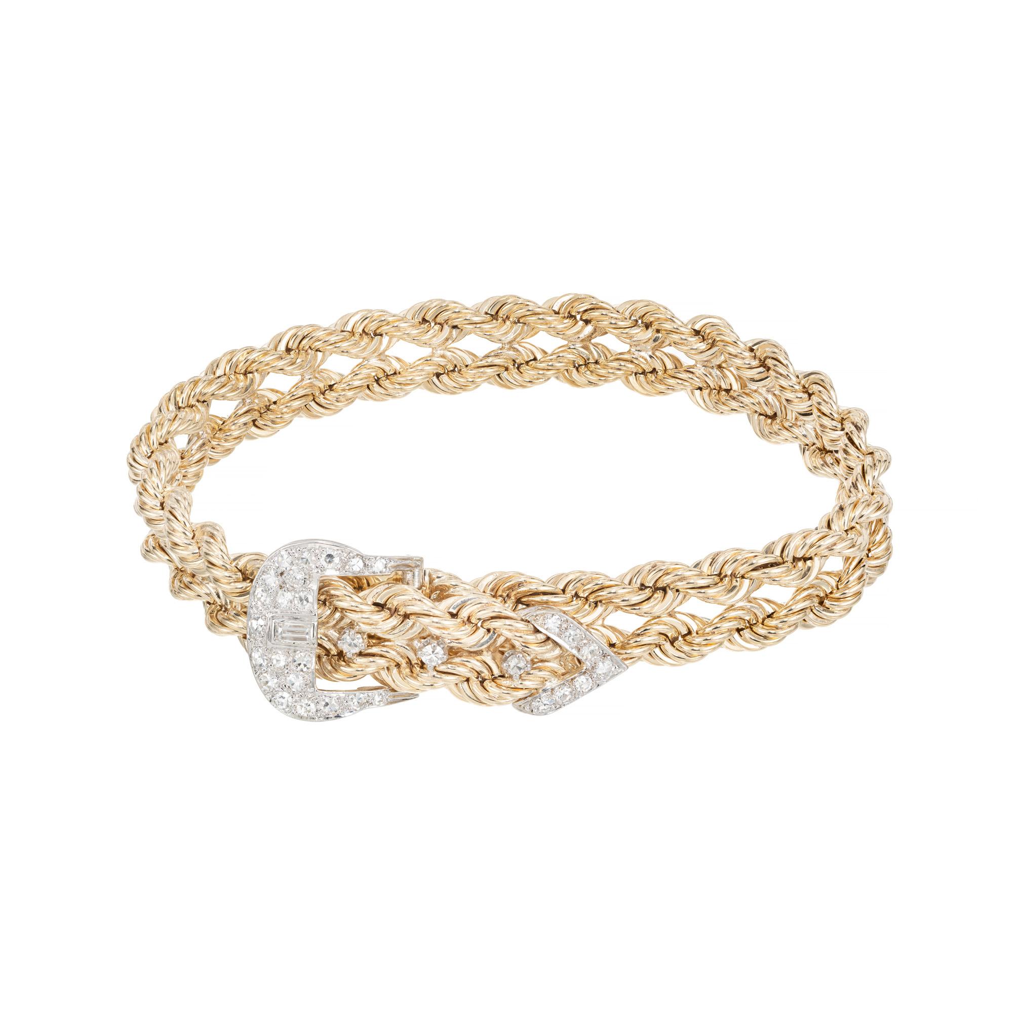 Double rope diamond bracelet. A step back in time. 1960's 14k yellow gold rope bracelet with a 14k white gold buckle and V tip. set with 31 single cut pave set diamonds totaling .34cts. One single baguette diamond sits in the center of the buckle