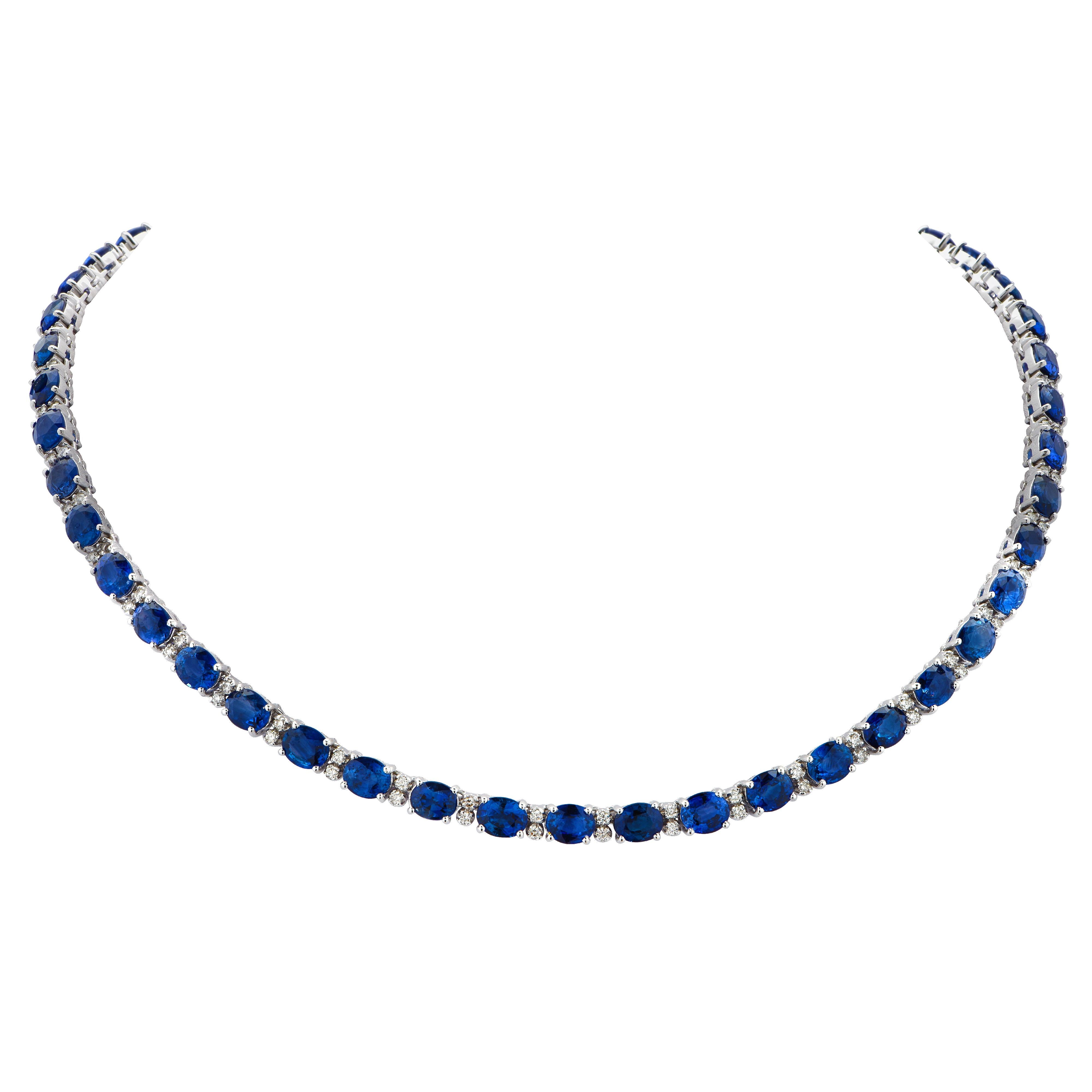 Stunning Sapphire and Diamond necklace crafted in 18 Karat white gold, showcasing 49 vibrant blue oval sapphires weighing approximately 40 carats total, accented by 98 round brilliant cut diamonds weighing approximately 2 carats total, G color,