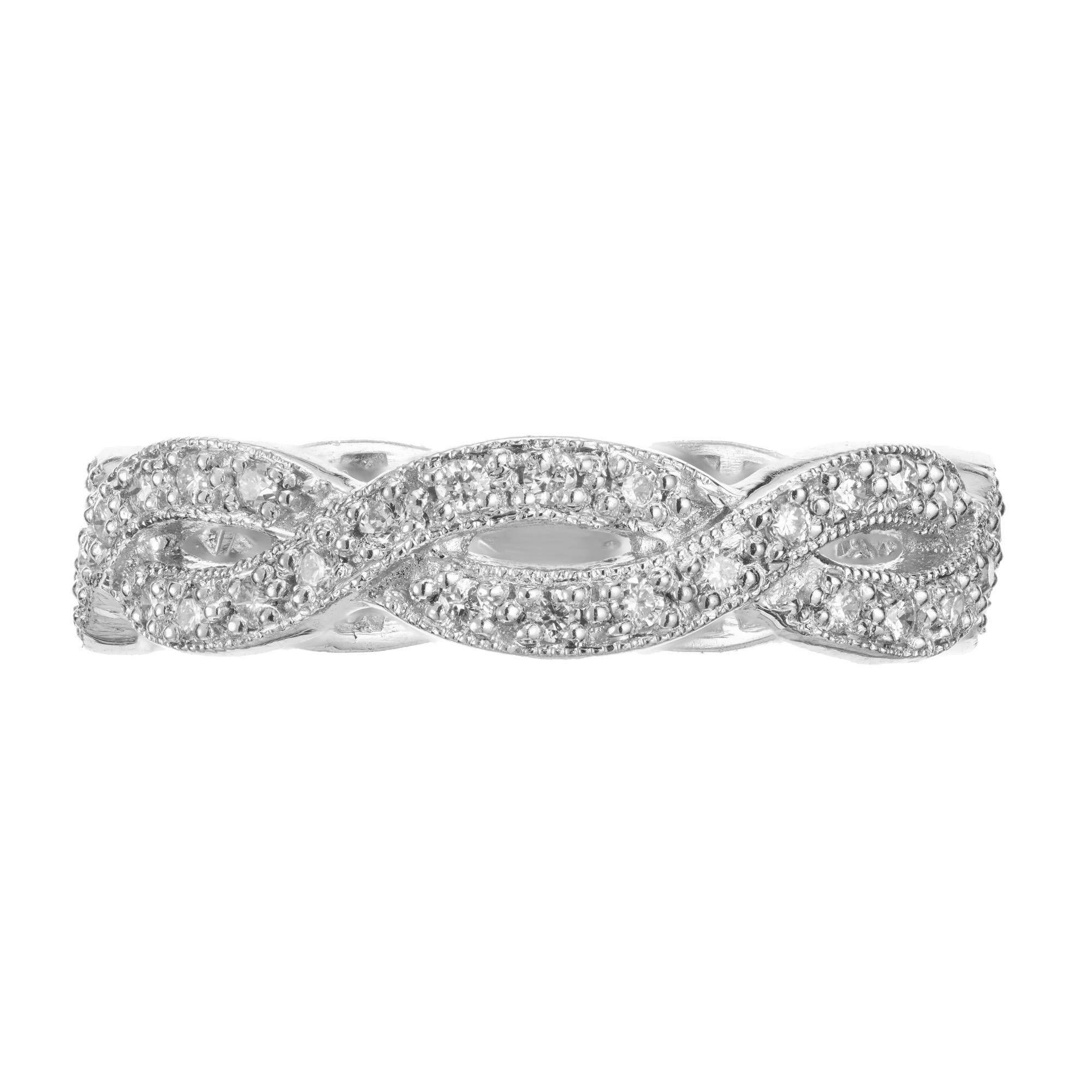 Diamond wedding band ring. 58 full cut round diamonds set in a platinum cross over wedding band design.  

58 full cut diamonds, approx. total weight .40cts, G, VS
Size 6 and not sizable
Platinum
Stamped: 950
3.5 grams
Tested: Platinum
Width: