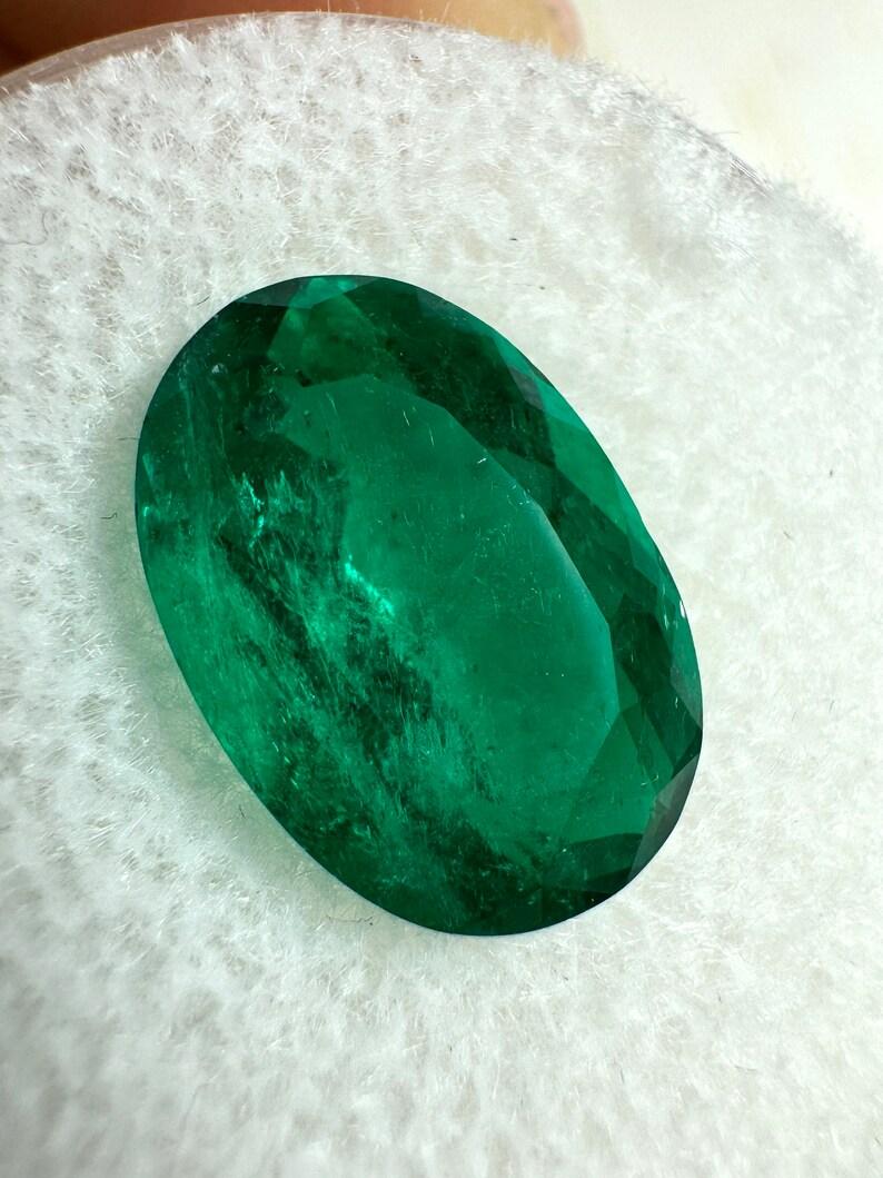 Stone: Emerald
Weight: 4.0-carats
Shape: Oval Cut
Clarity: Transparent
Luster: Excellent-Very Good
Color: Vivid Dark Green
Measurements: 12.65mm x 8.73mm x 5.94mm
Geographic Origin: Colombia
Treatment: Natural, Oiling

Comments: Due to their growth