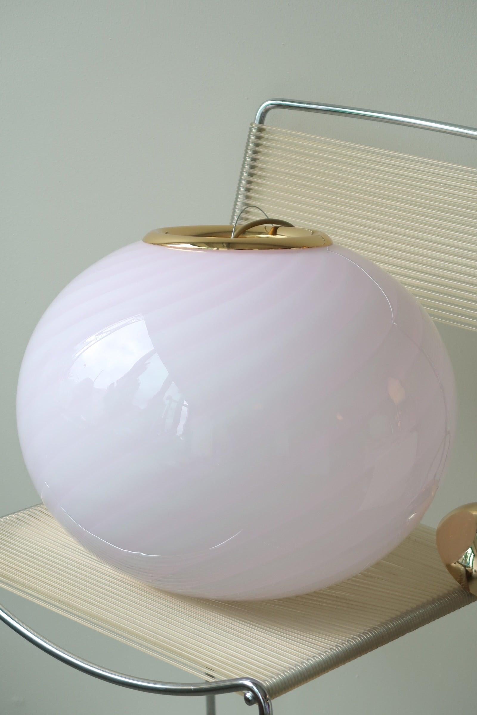 Will be available for shipping on May 10th 2024
Large new Italian Murano candy pendant ceiling lamp in soft pink. Mouth-blown glass in oval shape with swirl pattern. E27 socket. Comes with adjustable brass plated suspension.
Handmade in Italy.
D:40