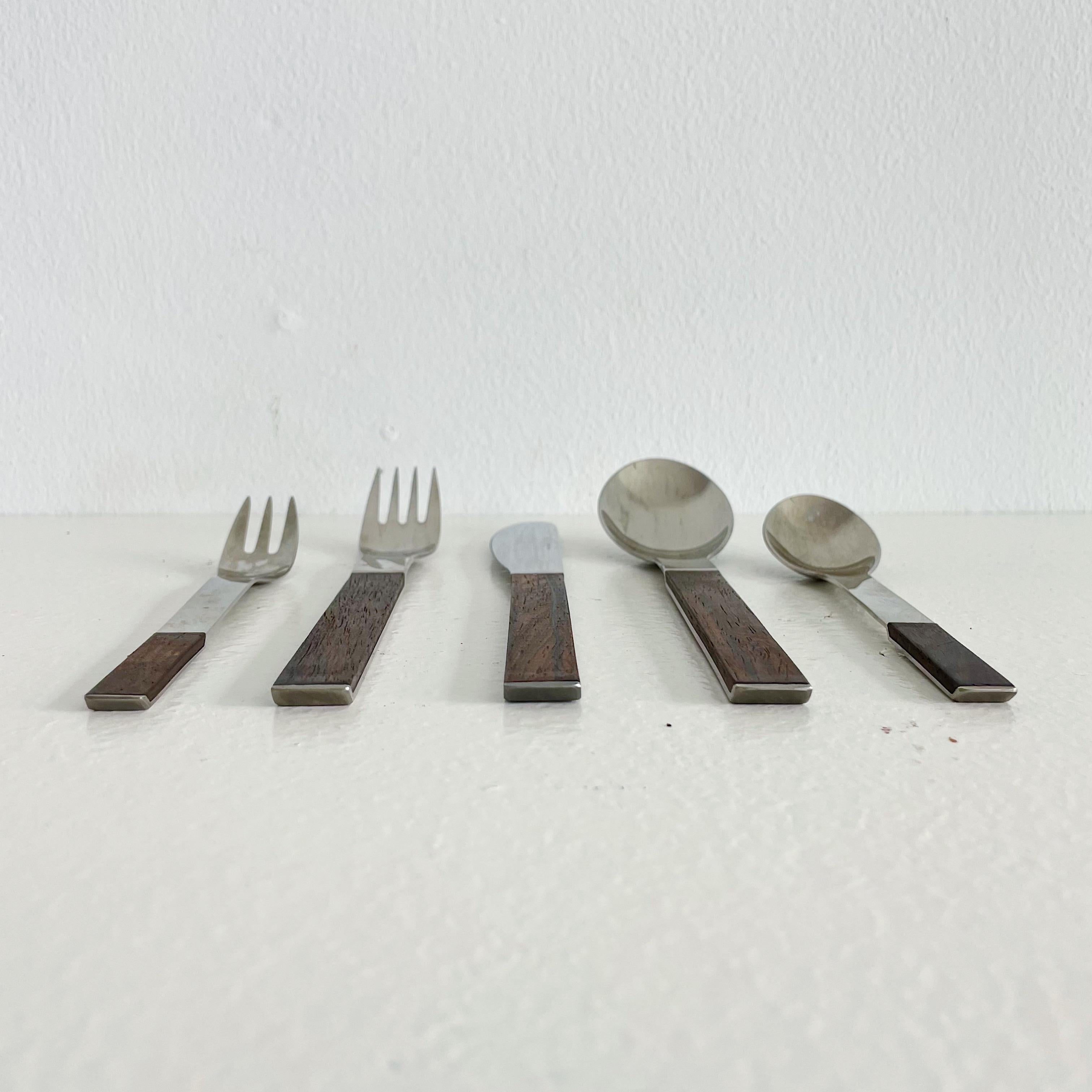 Exceptional rosewood and stainless steel flatware set 'Duo' for 8 place settings designed by Carl Auböck and made by for Rosenthal Austria, circa 1967. Each set is comprised of five pieces (fork, knife, spoon, salad or dessert fork, teaspoon) a