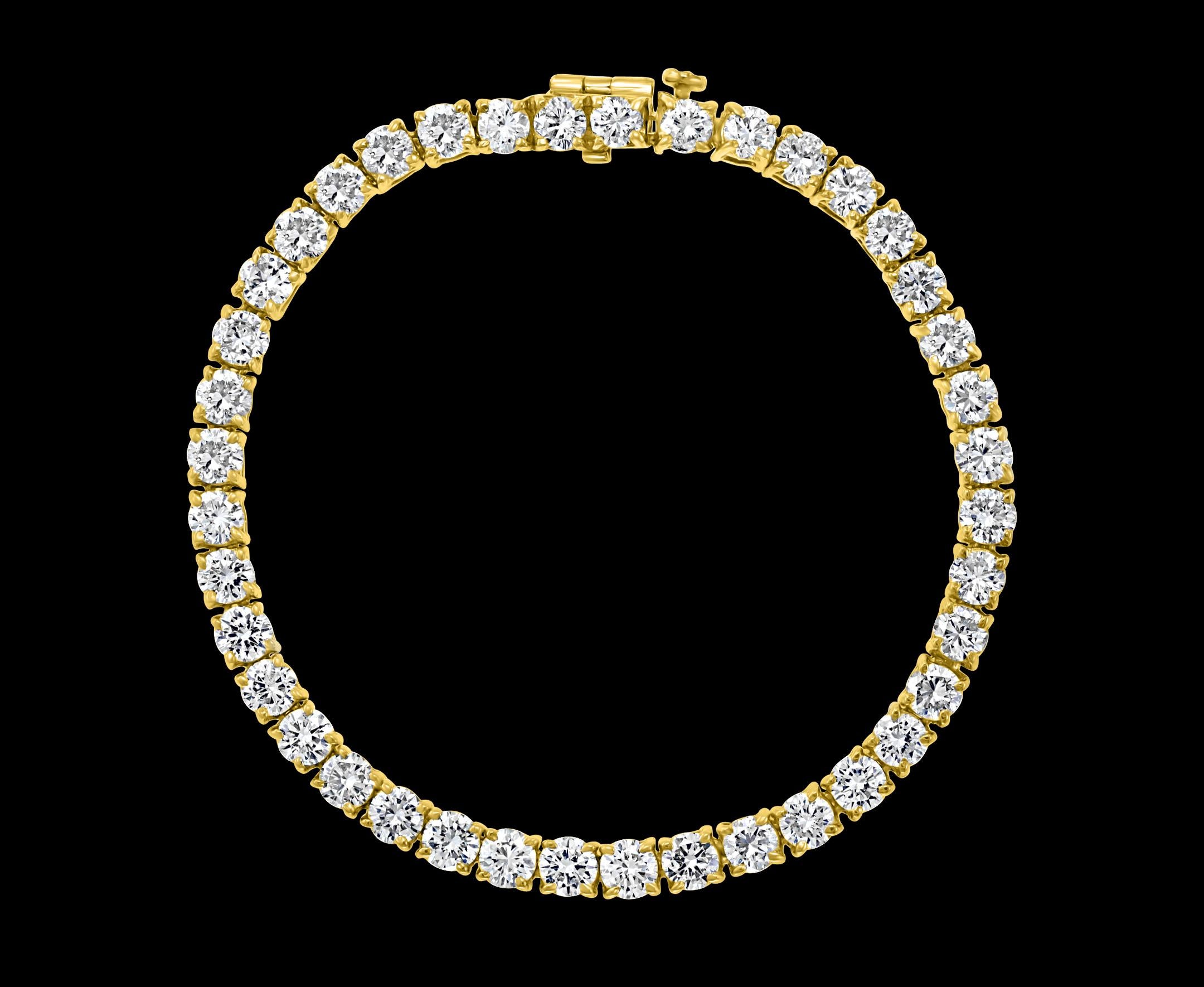 
40 Round Diamond 25 Pointer Each Tennis Bracelet in 18 K Yellow Gold 10 Ct Line Bracelet
Meet the ultimate bold tennis bracelet. The single row of prong set Round Brilliant cut Diamonds.
25 pointer each , 40 Total pieces approximately 10 Ct
Very
