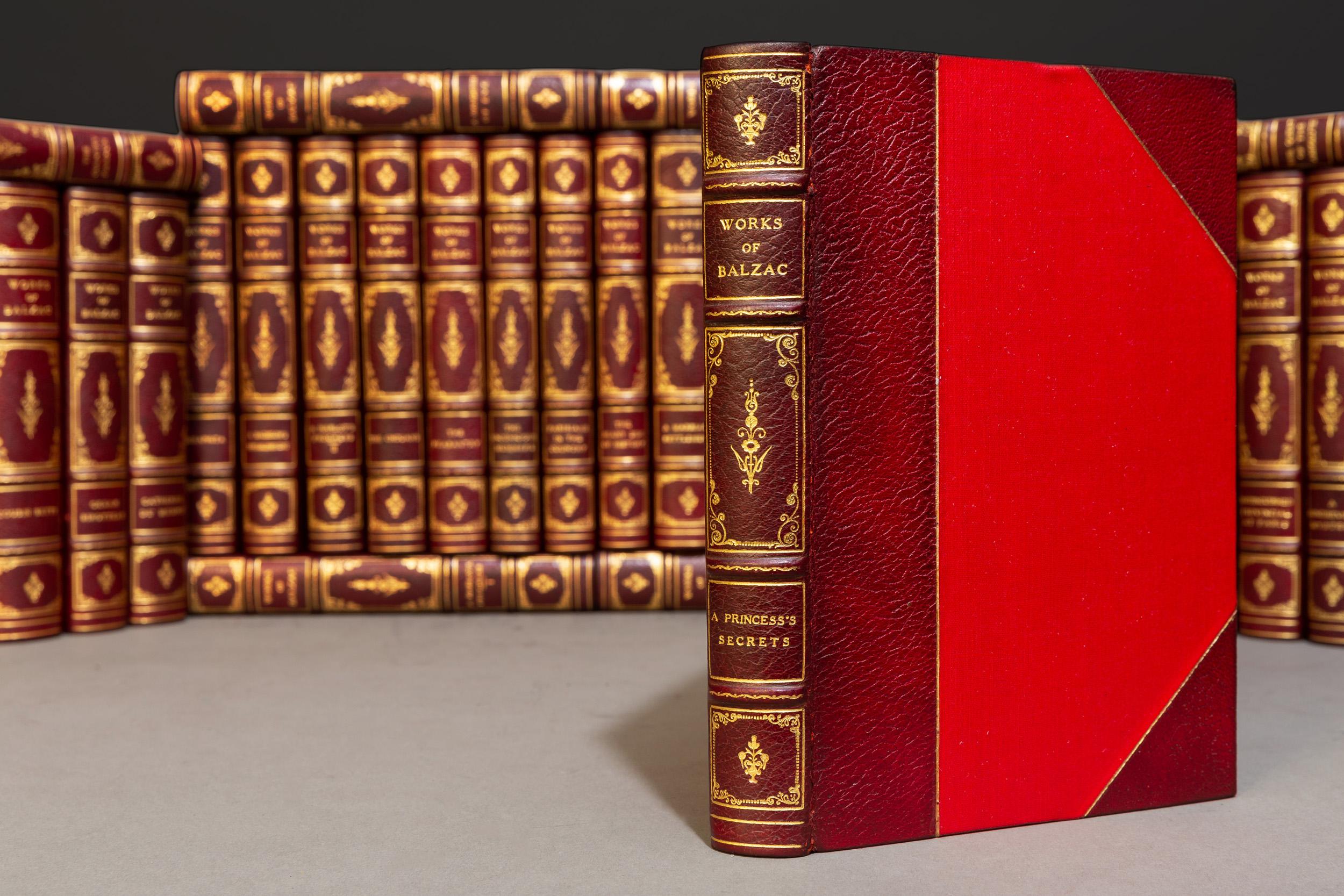 40 Volumes. Honoré de Balzac. The Complete Works. Translated by Clara Bell. With Preface by George Saintsbury. With frontispiece. illustrations and etchings by W. Boucher. Bound in 3/4 crimson morocco by Stikeman & Co. Linen boards. Gilt on spines &