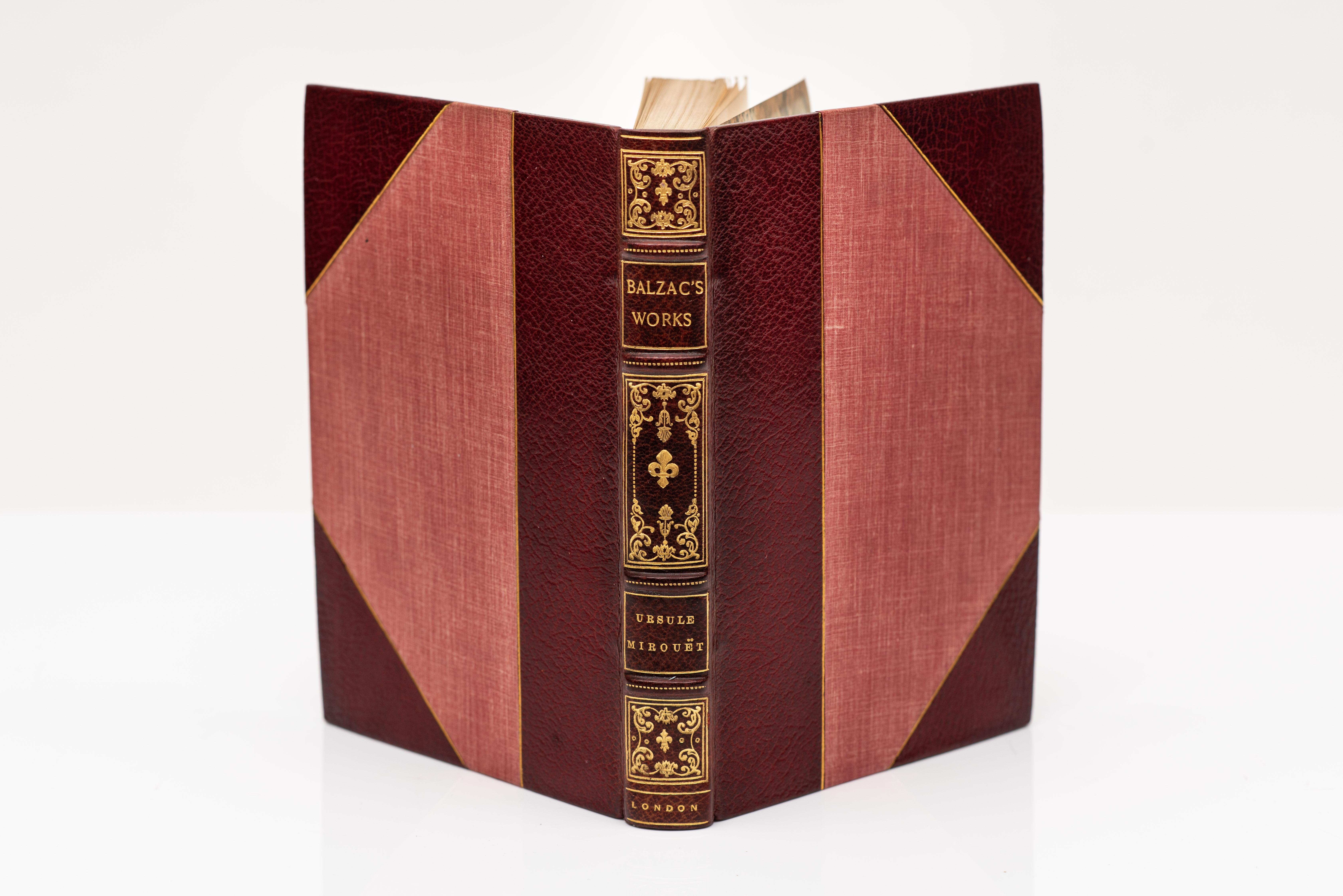 40 Volumes. Honoré de Balzac, The Works. Translated by Ellen Marriage. Bound in 3/4 red morocco with gilt tooling on the covers and raised band spines. Top edges gilt. Marbled endpapers. Frontispiece with illustrations throughout. Limited to 1,200