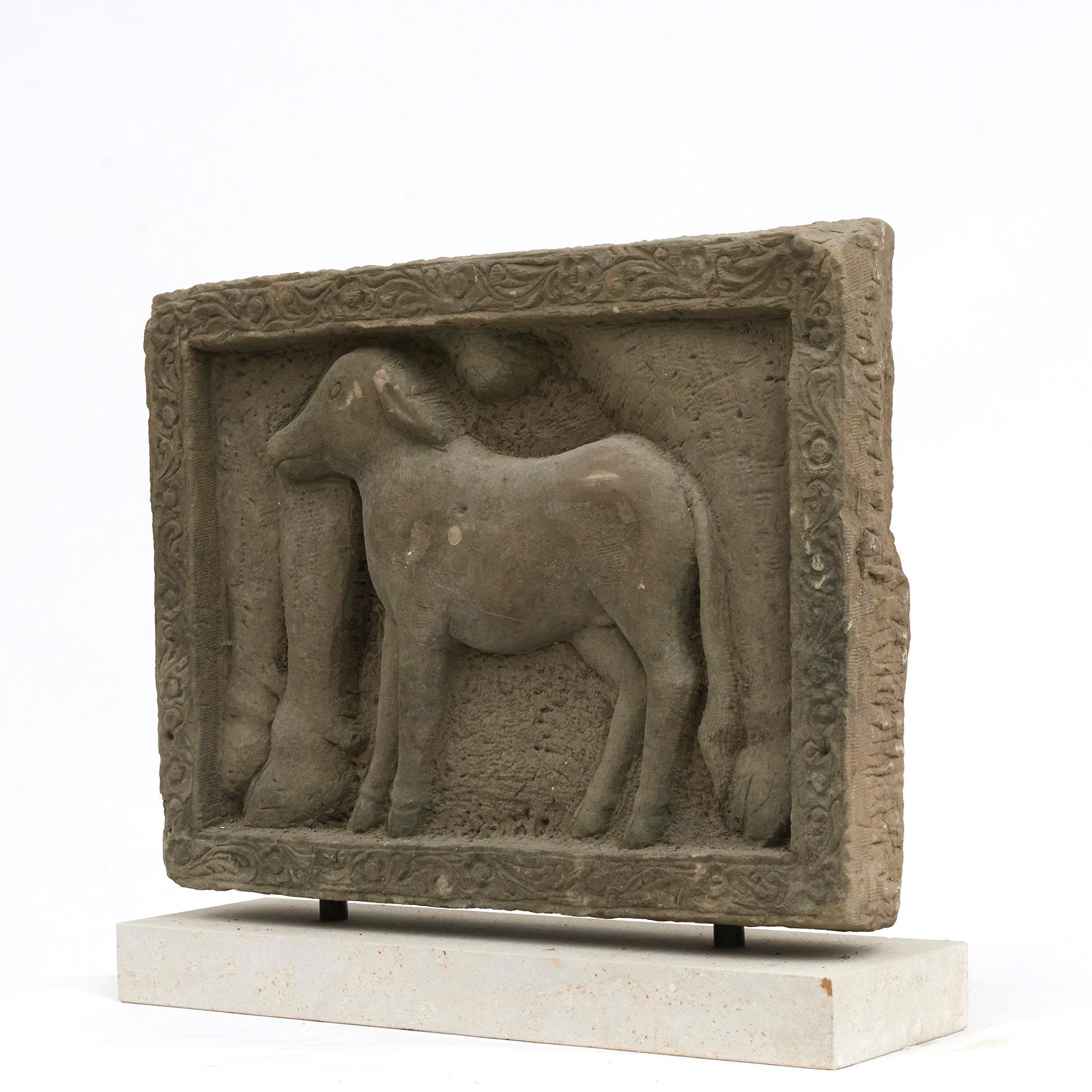 400 - 600 year old Burmese carved sandstone sculpture. Calf standing under the mother. From Buddha temple or Hindu temple in Burma. Untouched in original condition, mounted on a light sandstone plinth.


Provenance from Danish private collection.