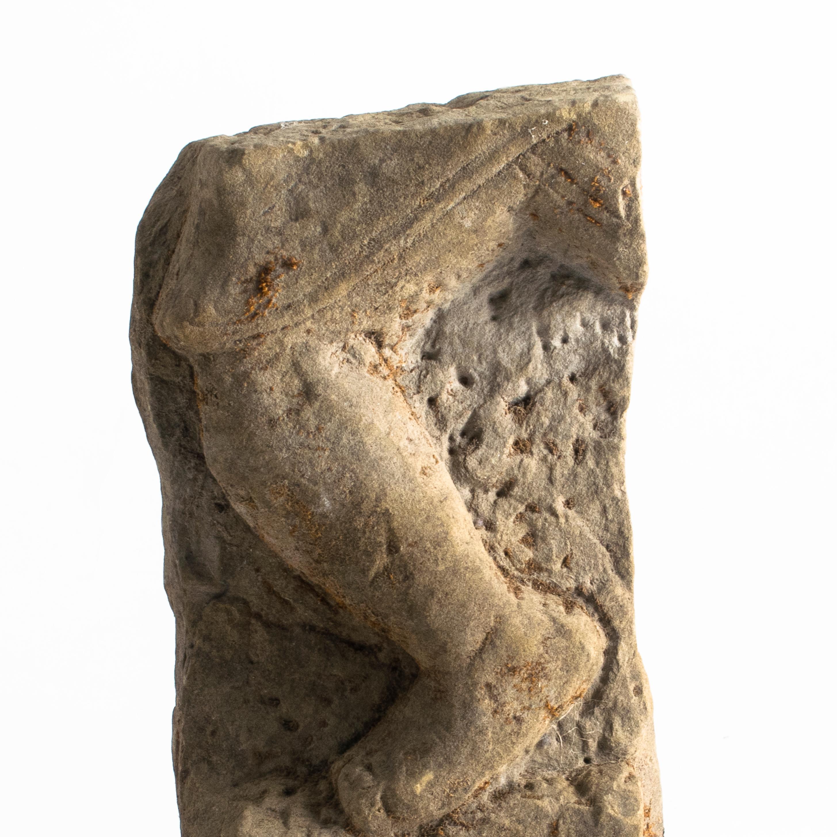 This sculptural leg fragment was part of a larger sandstone statue that originates from a paragode in Burma, circa 16th-17th century.
Excavated from the ground after the great 1762 Arakan earthquake.

Provenance from Danish private