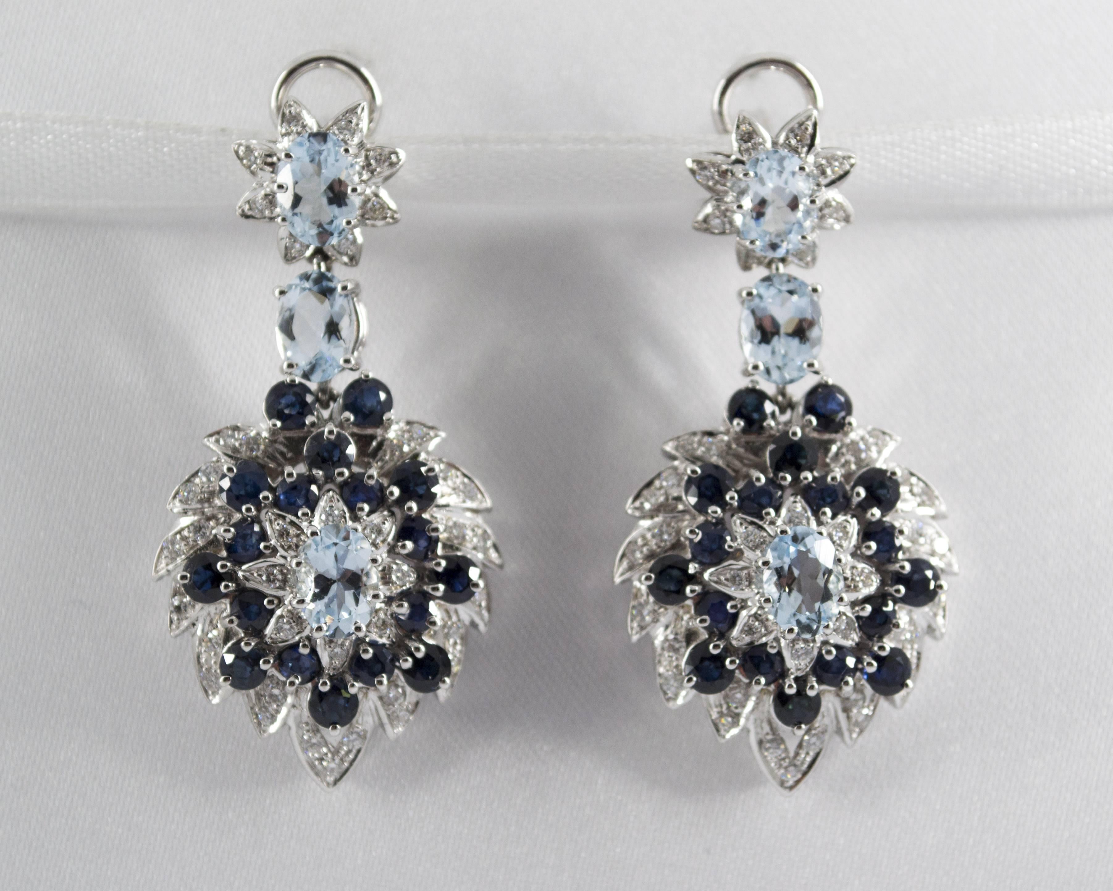 These Earrings are made of 18K White Gold.
These Earrings have 1.00 Carats of White Diamonds.
These Earrings have 5.10 Carats of Blue Sapphires.
These Earrings have also 4.00 Carats of Aquamarines.
All our Earrings have pins for pierced ears but we