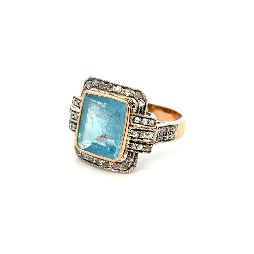 Simply Beautiful! Finely detailed Aquamarine and Diamond Gold Vintage Ring. Centering a securely Hand set 4.00 Carat Aquamarine Gemstone. Surrounded by Diamonds, weighing approx. 0.50tcw. Hand crafted Silver on 18K Yellow Gold mounting. Size 7.5, we