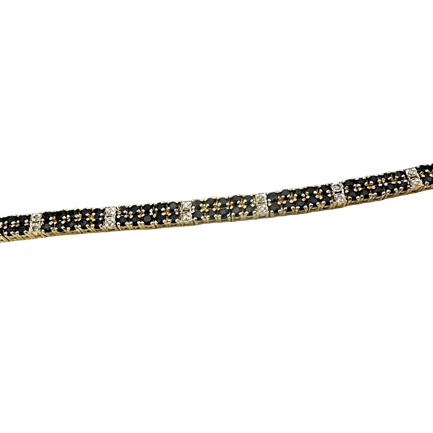 This gorgeous Black Sapphire Diamond Pave Bracelet is crafted with sterling gold electroplate and features a double row of black sapphire stones for added sparkle and shine. Its unique design is perfect for special occasions while also adding an