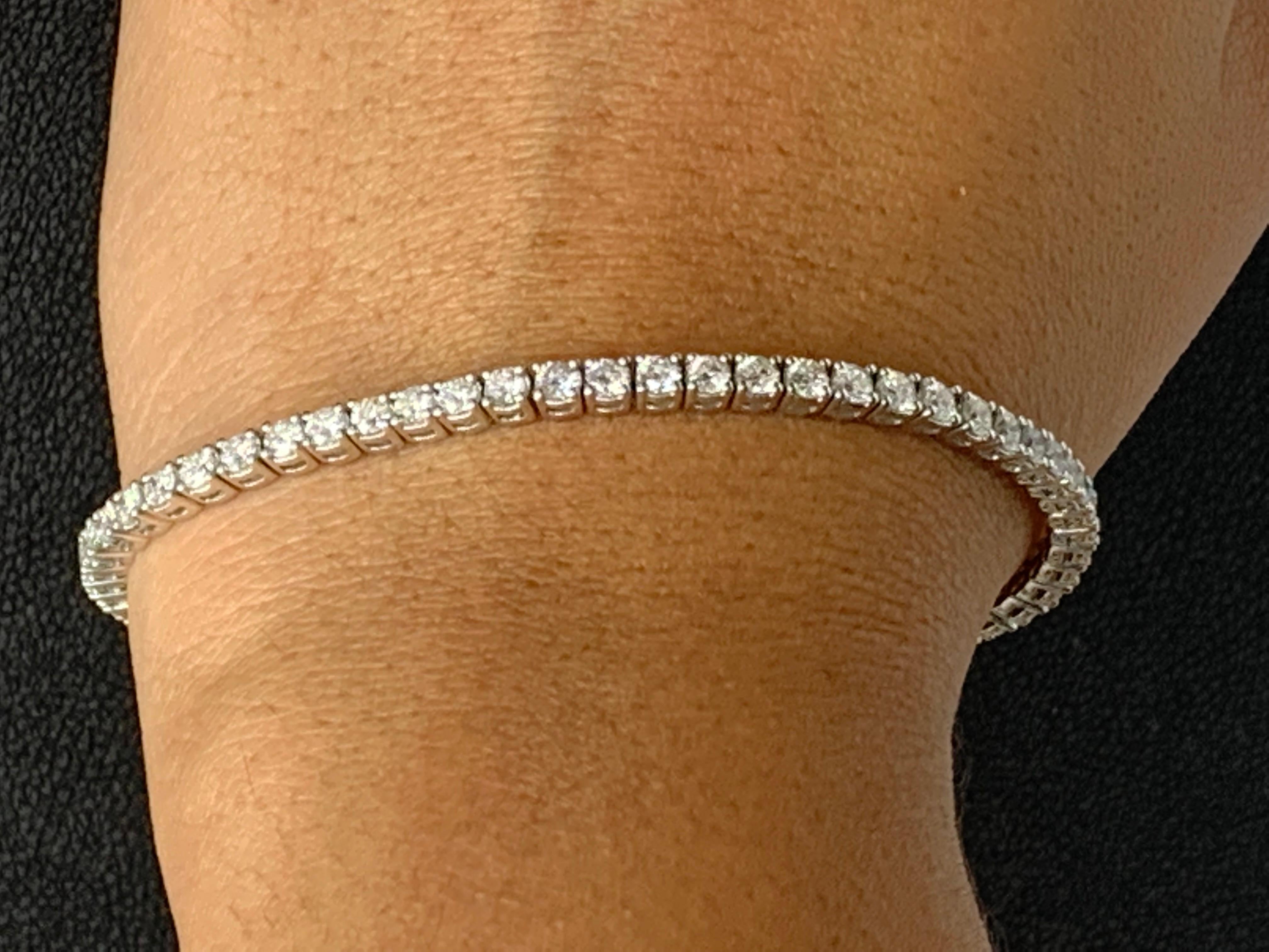A classic tennis bracelet style showcasing a row of round brilliant diamonds, set in a polished 14k white gold mounting. 59 Diamonds weigh 4.00 carats total and are approximately GH color, SI1 clarity.

Style is available in different price ranges.