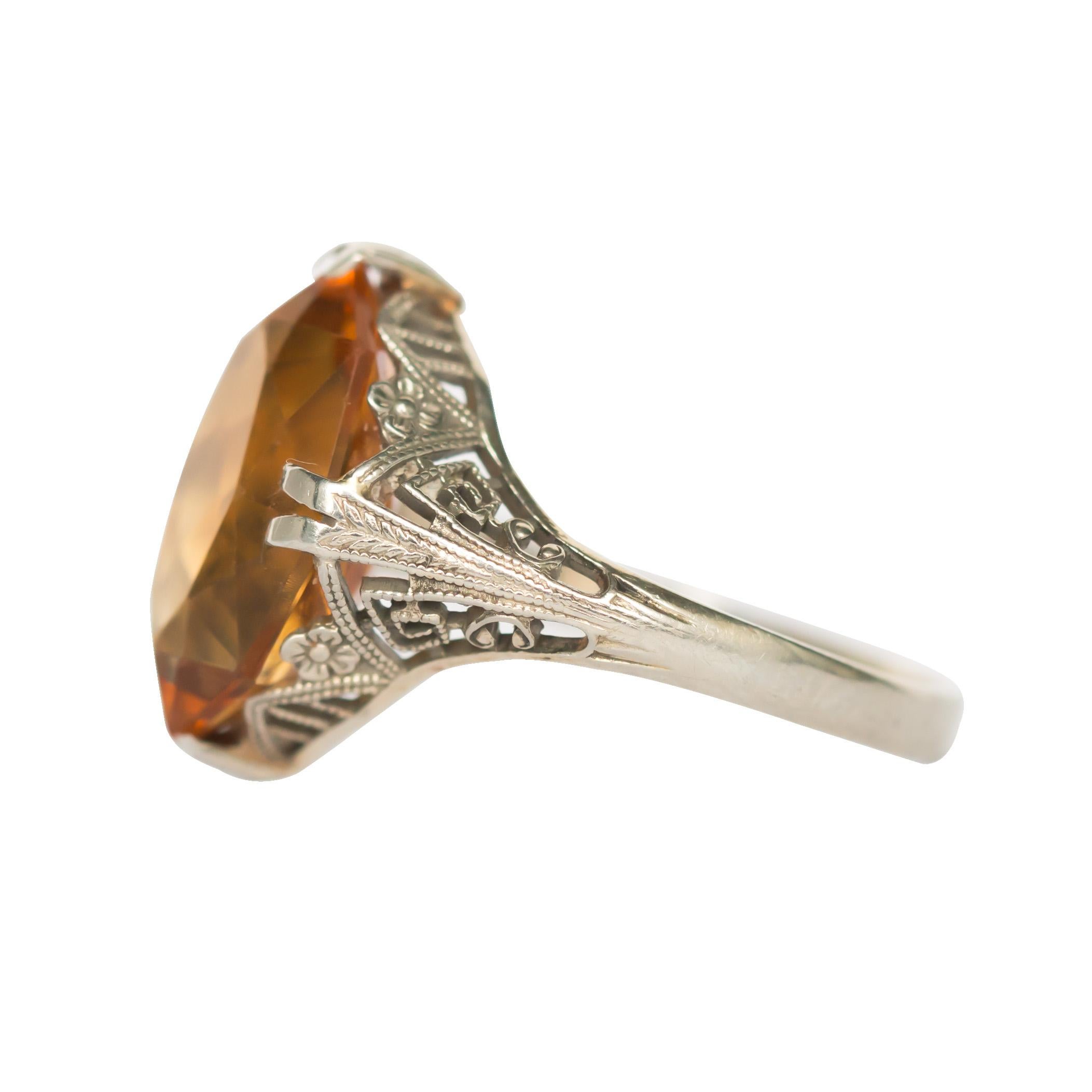 Ring Size: 8
Metal Type: 18 karat White Gold 
Weight: 3.2 grams

Color Stone Details: 
Type: Citrine
Shape: Marquise 
Carat Weight: ~4.00 carat
Color: Deep Orange Color 

Finger to Top of Stone Measurement: 5.05mm