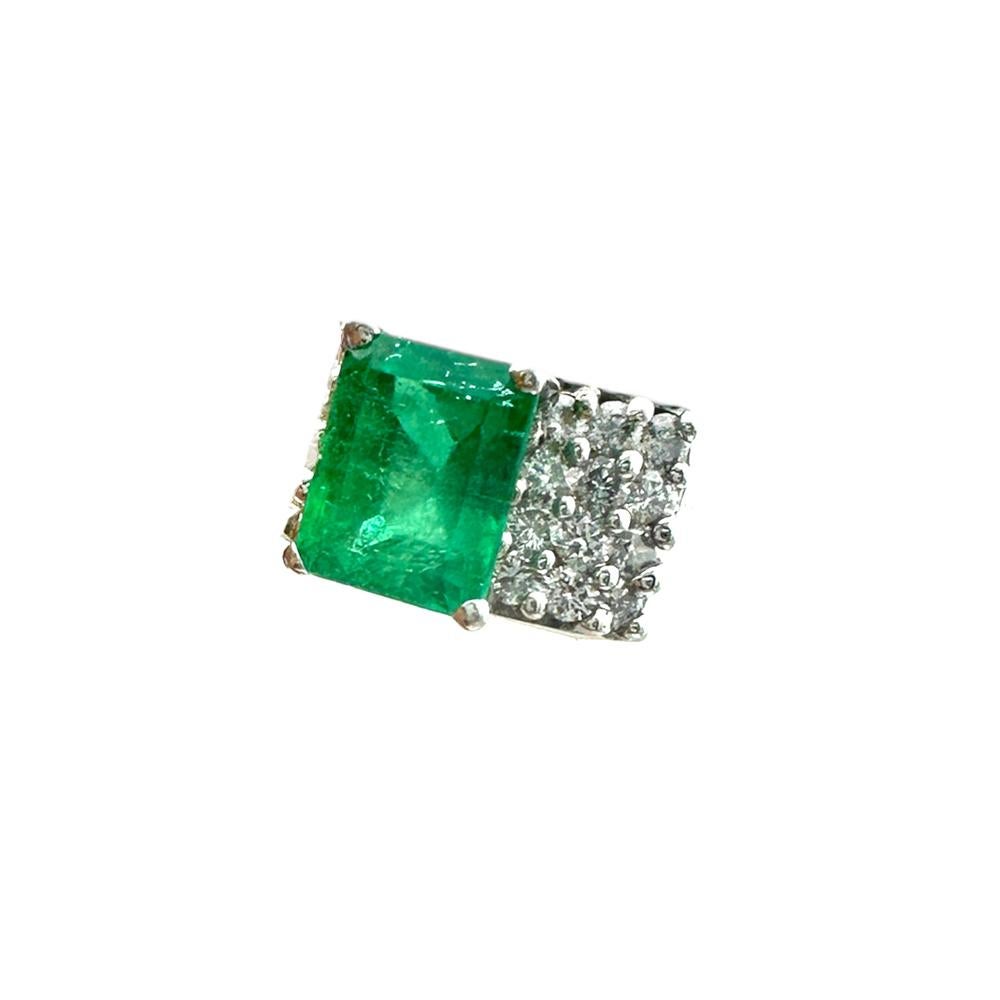 This beautifully crafted 18K white gold 4.00 ct emerald and diamond solitaire ring offering timeless beauty, makes a perfect statement and is sure to turn heads. The 4.00 ct emerald is set at the center of the ring accented with dazzling round cut