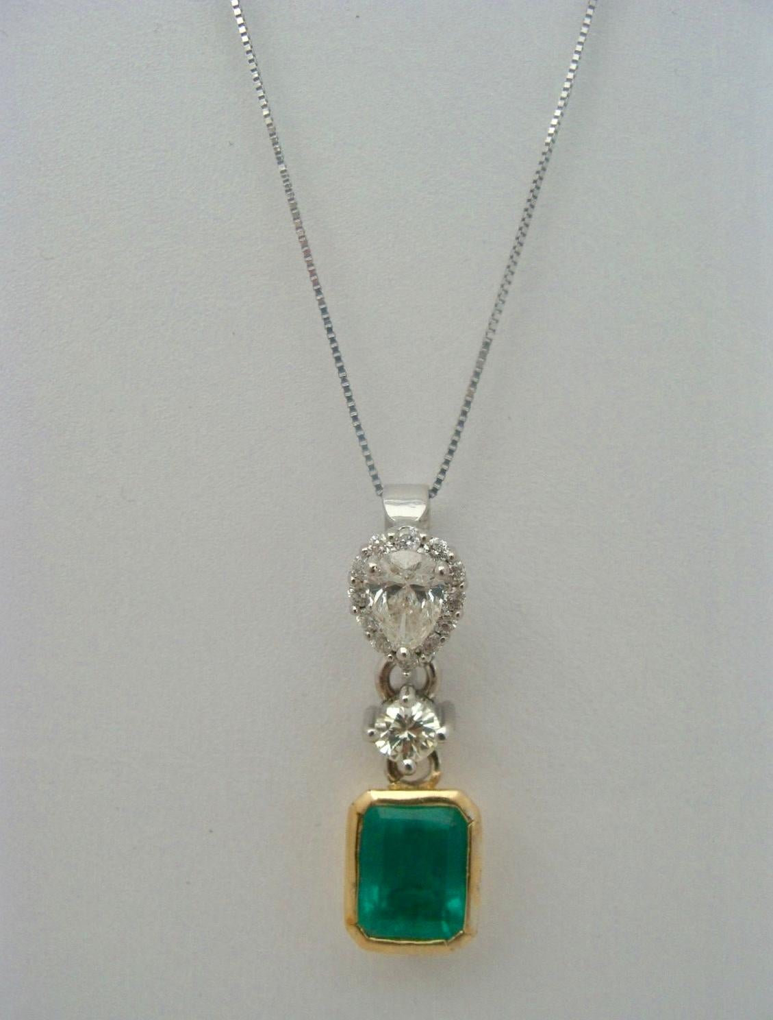 Gorgeous Pendant is made of Solid 18K White & Yellow Gold
Featuring a Fine Natural Colombian Emerald Emerald Cut Approx. Weight 3.00 Carats AAA Vivid Medium Green Fully Saturated Excellent Clarity & Transparency Set with Total Diamonds Total approx.