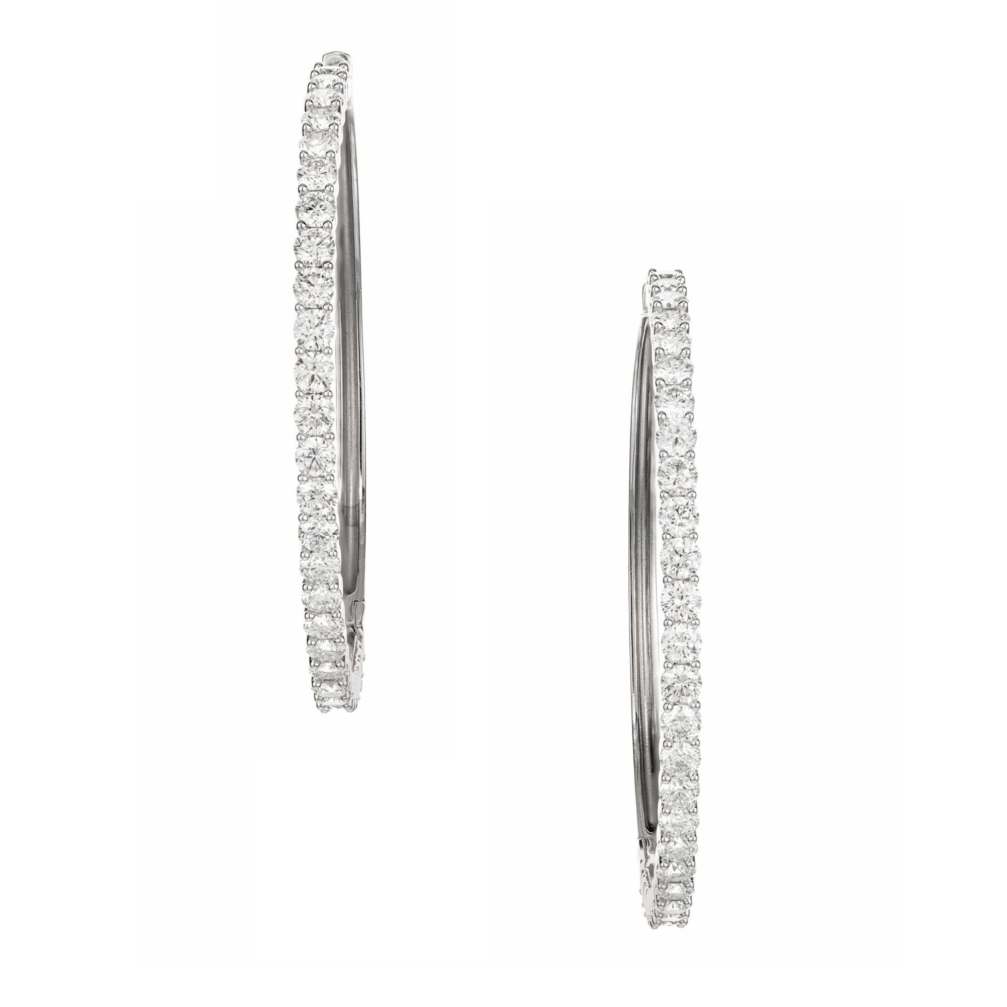 Just under 2 Inch diameter 4.00 carat diamond large hoop earrings. Set in 14k white gold with 56 round brilliant cut diamonds. 

56 round brilliant cut diamonds, G VS approx. 4.00cts
14k whtie gold 
Stamped: 14k
11.3 grams
Top to bottom: 48.3mm or