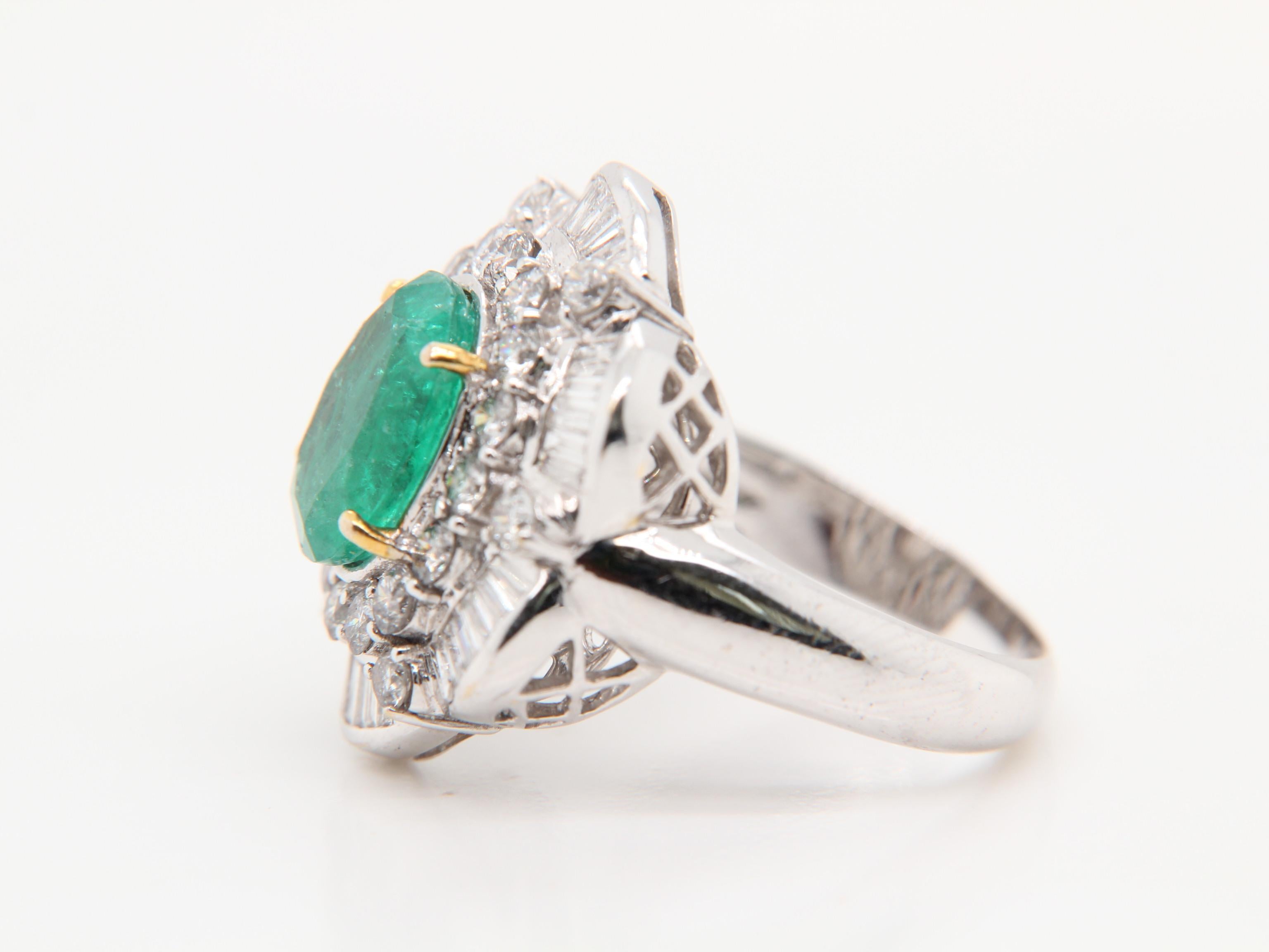 A brand new emerald cocktail ring in 18 karat gold. The centre emerald is oval shaped and weighs approximately 4.00 carats. The diamonds weigh 1.50 carats. The gross weight of the whole ring is 8.44 grams. There is some porosity on the band of the