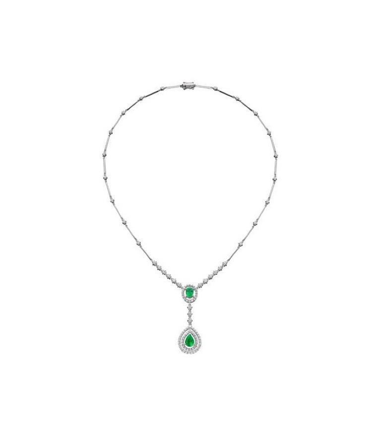A stunning 4.00 Carat Emerald and Diamond Necklace featured with an oval cut genuine Emerald and one pear shaped genuine Emerald with a combined weight of approximately 1.94 Carats and ninety-nine bezel set round brilliant genuine Diamonds weighing